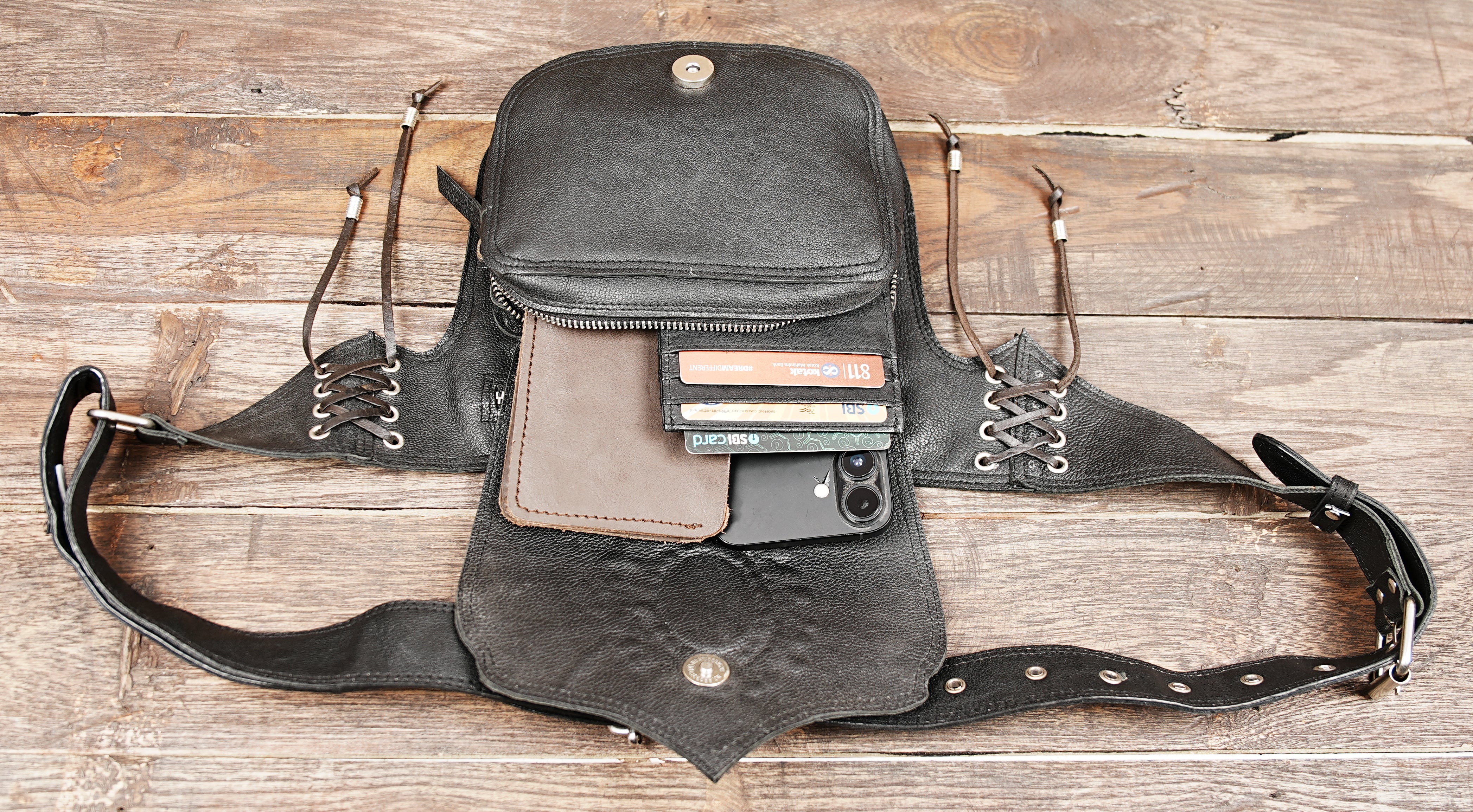 Genuine leather festival belt bag featuring gemstone embellishment and lace-up sides.