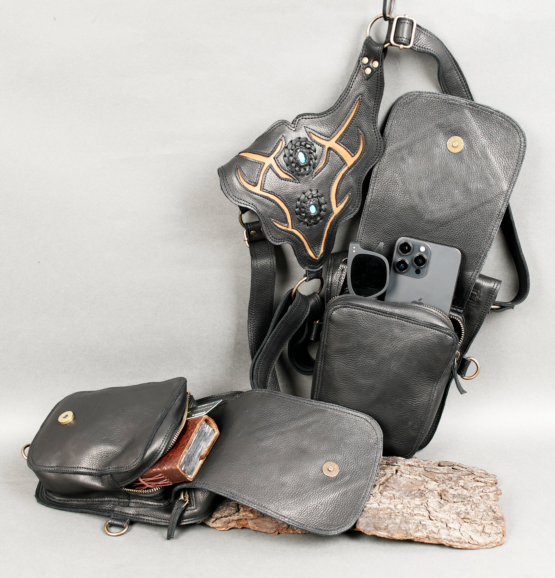 Steampunk-style leather holster with multiple attachment rings.