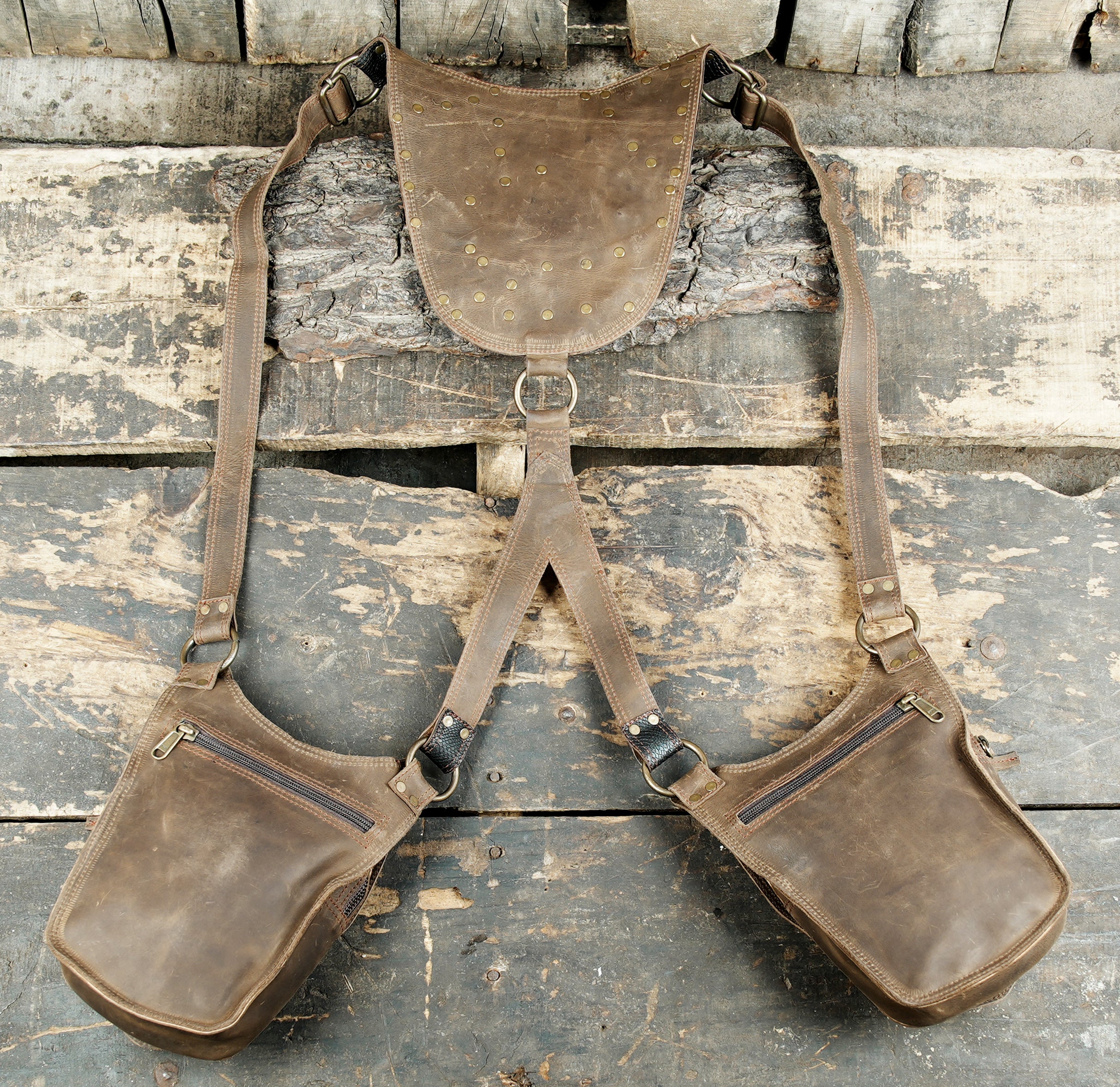 “Patchwork tribal leather holster with gemstone inlay and adjustable straps”