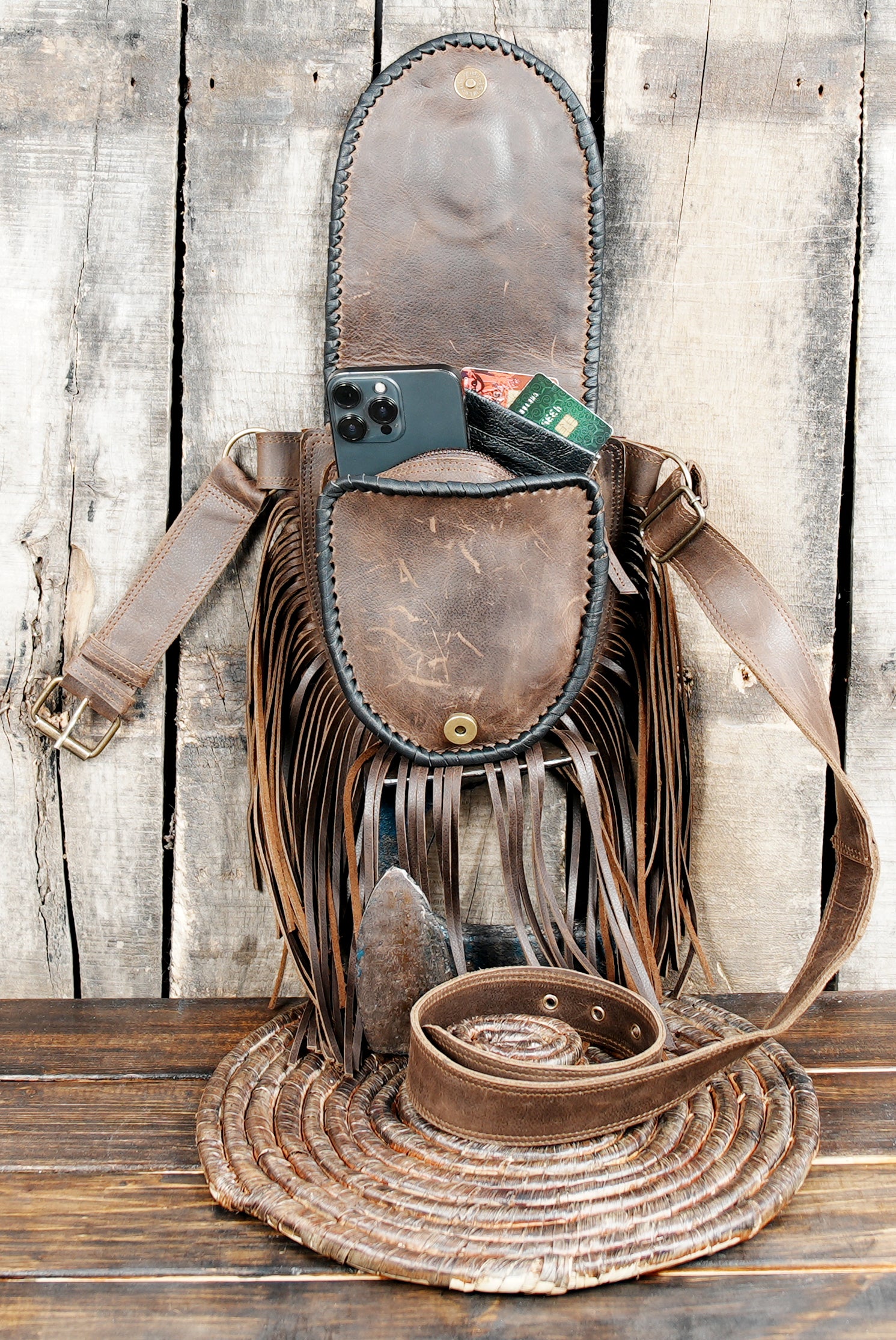Close-up of gemstone on brown leather Western belt pouch