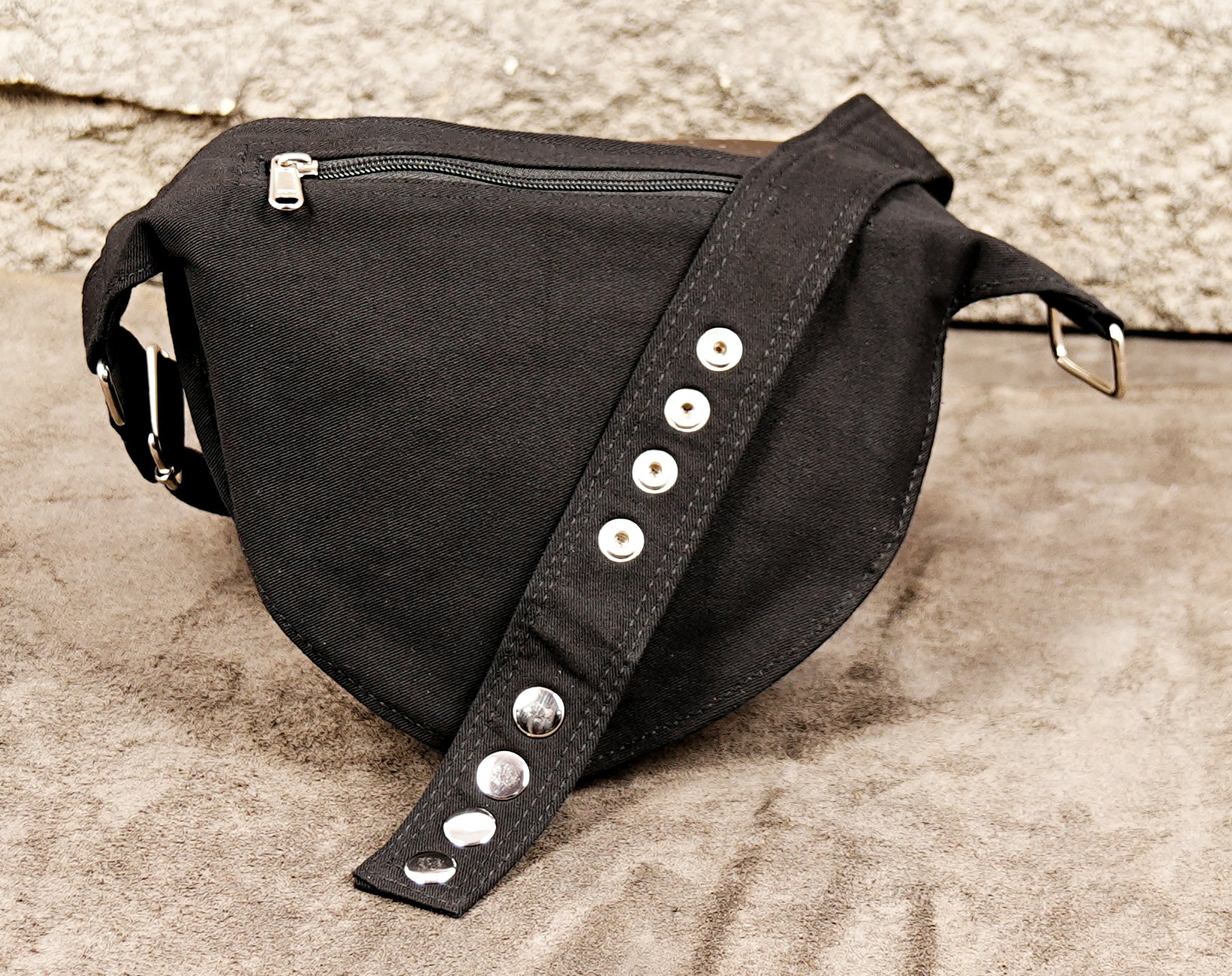 Black utility hip bag with modern zipper design