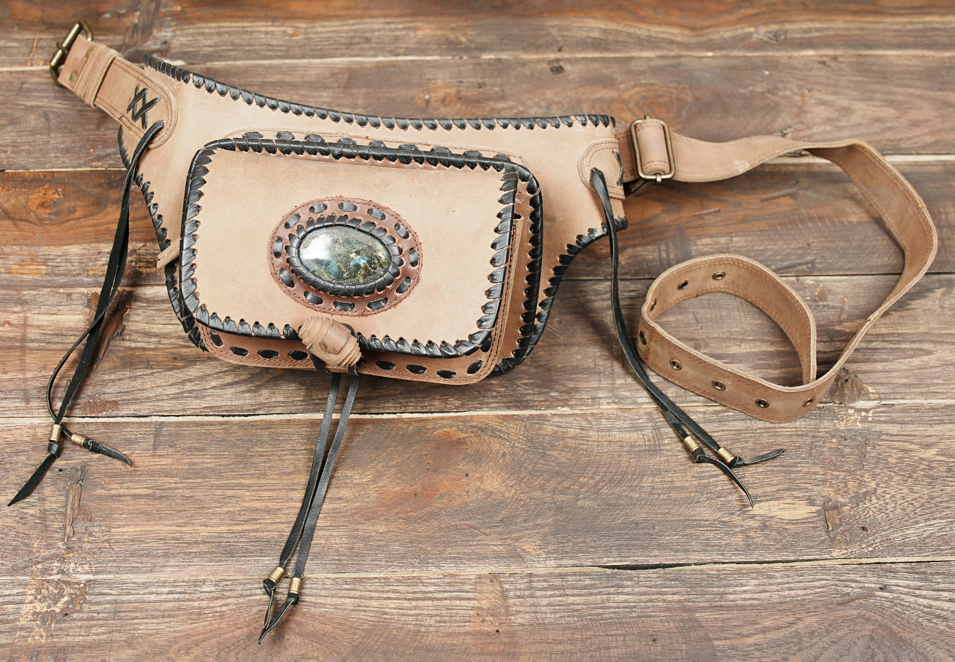 Leather waist belt bag with detailed stitching and stone embellishment