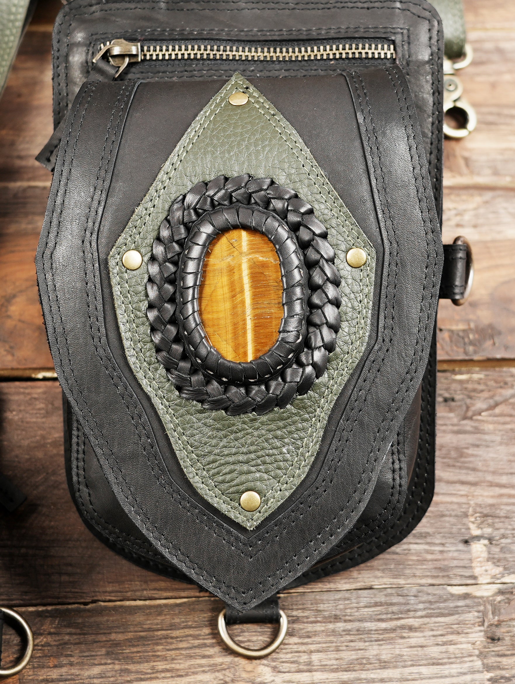 Dual pouch leather shoulder harness featuring braided stone inlay