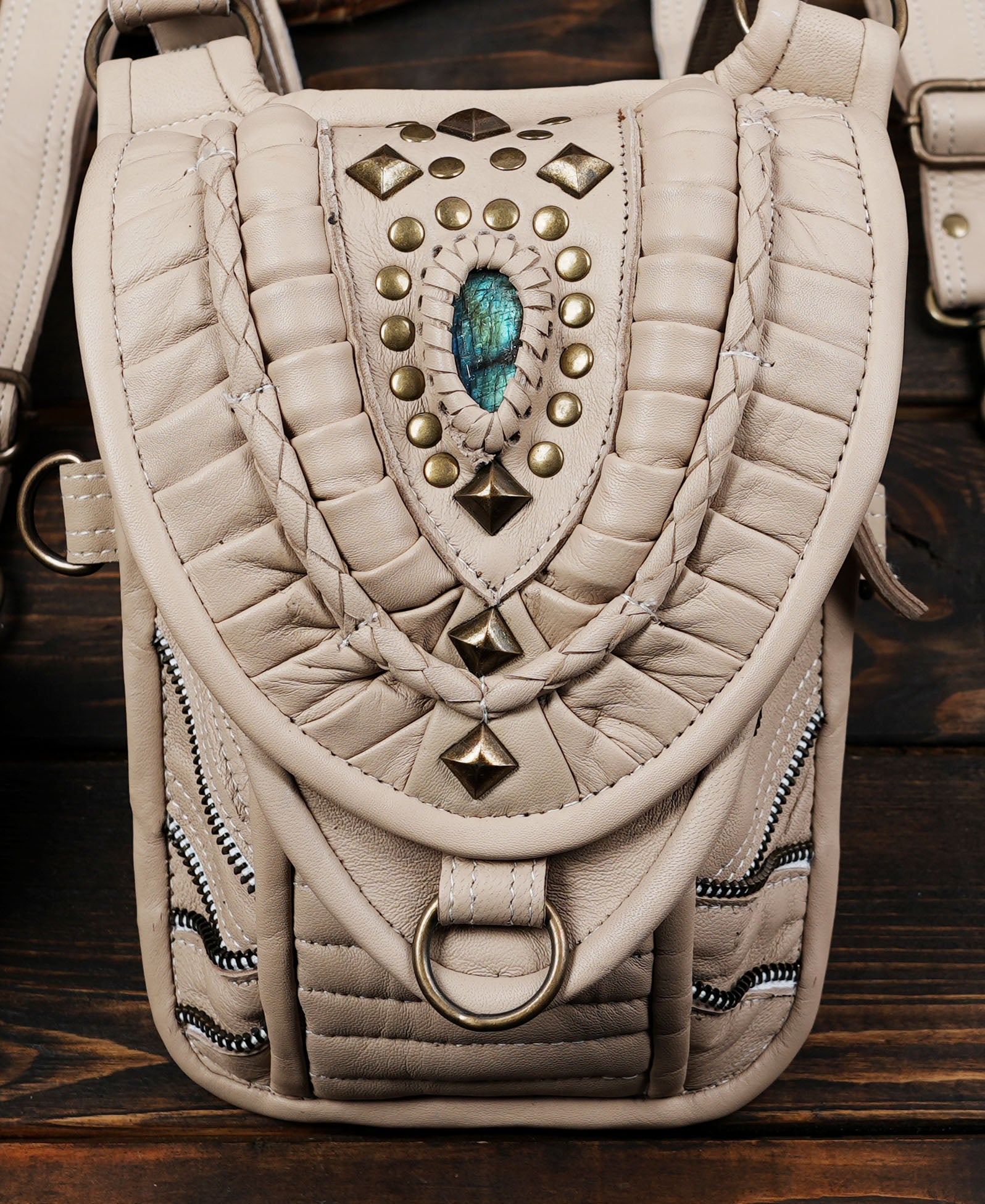 “Festival-ready ivory leather holster with double pockets and tribal artwork”