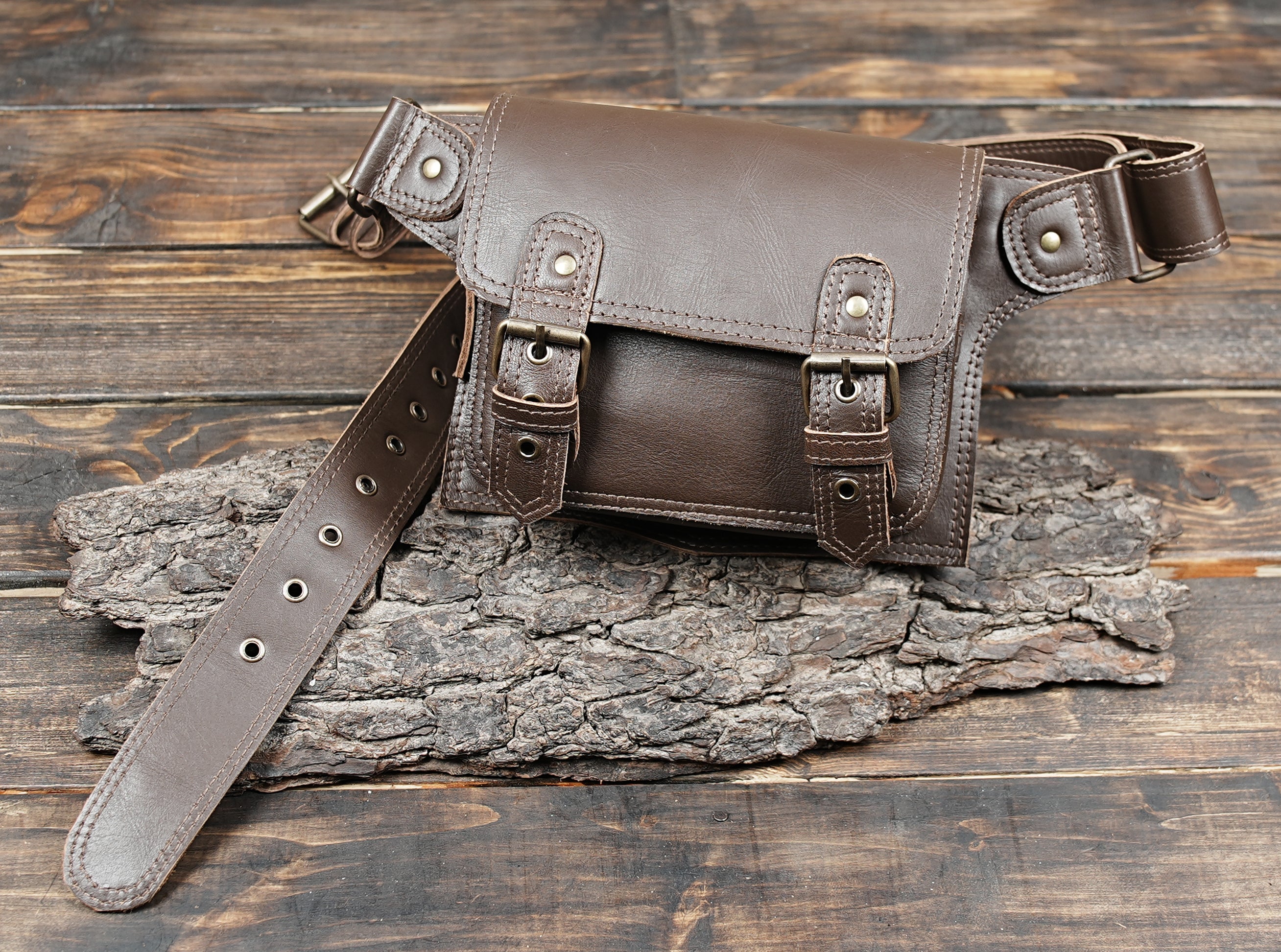 Brown leather belt bag with buckle strap front view