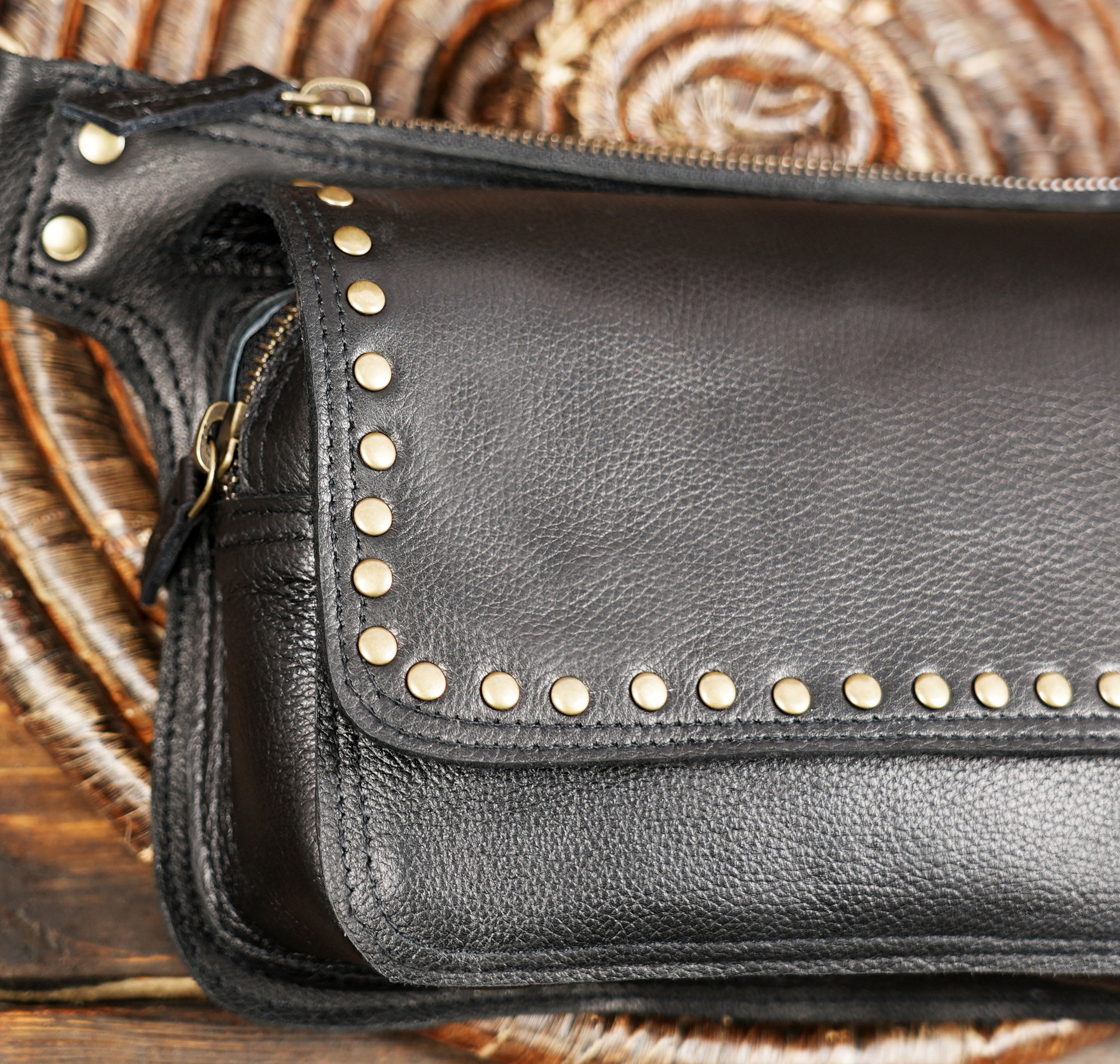 Studded black leather travel waist bag for outdoor adventures