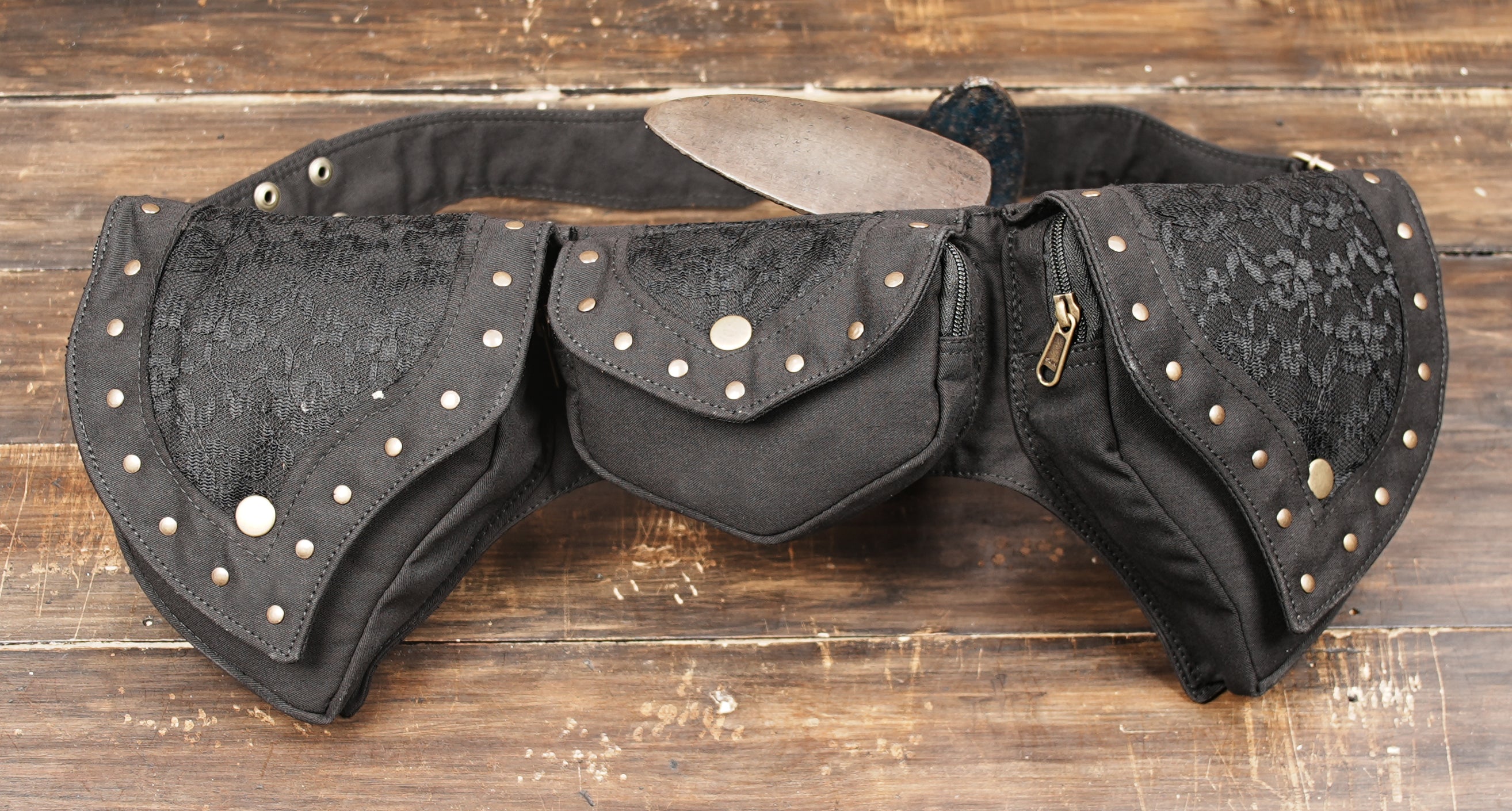 Studded gothic hip bag with wide grommet strap for travel and raves