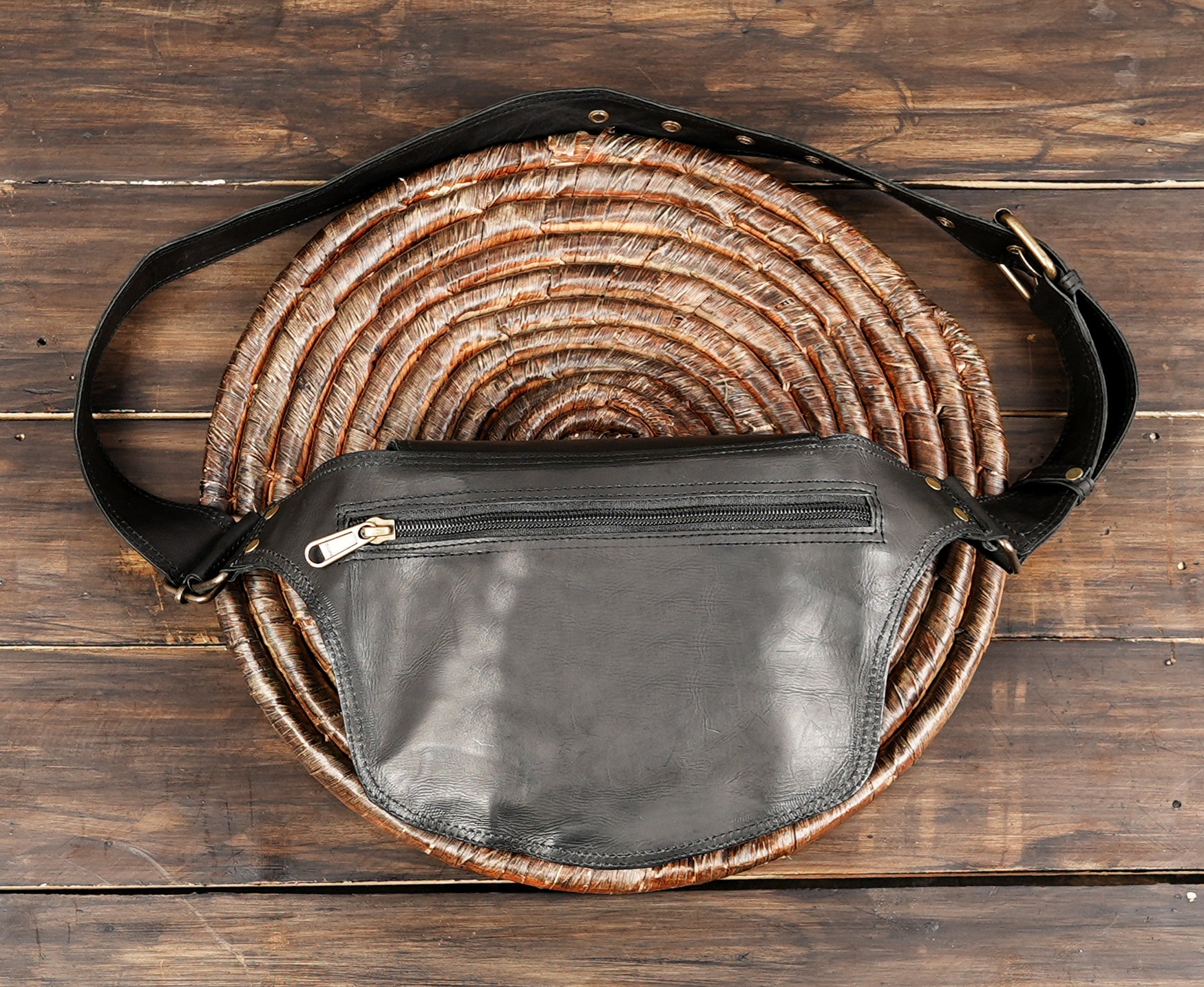 Durable leather waist pack with adjustable buckle and stone detail