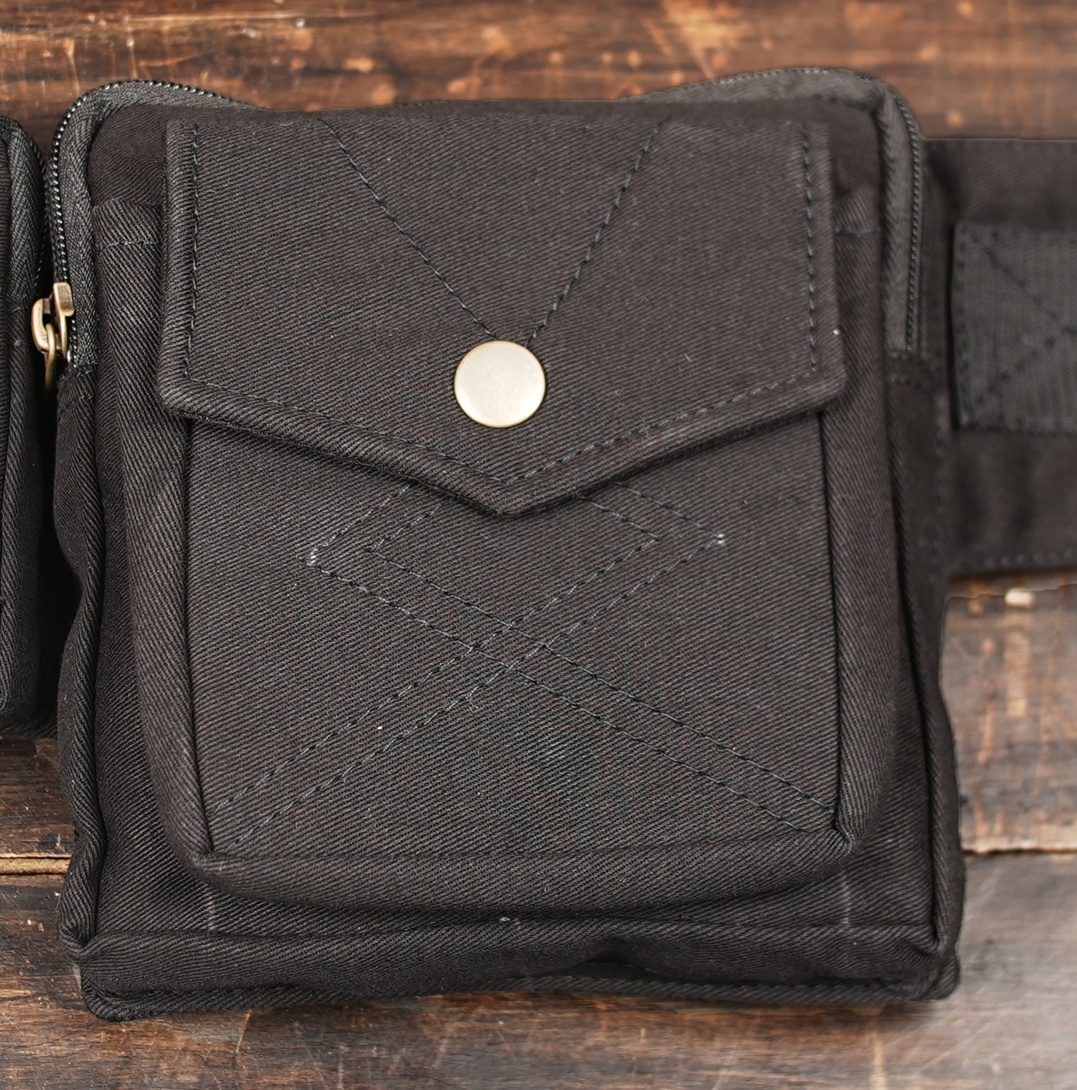 Festival ready hip pouch with multiple compartments and adjustable strap