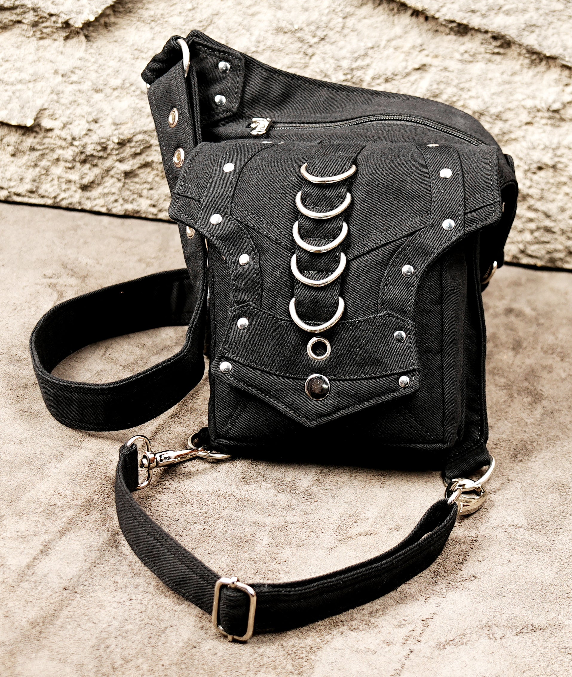 Versatile black canvas leg pouch equipped with metal rings and secure pockets