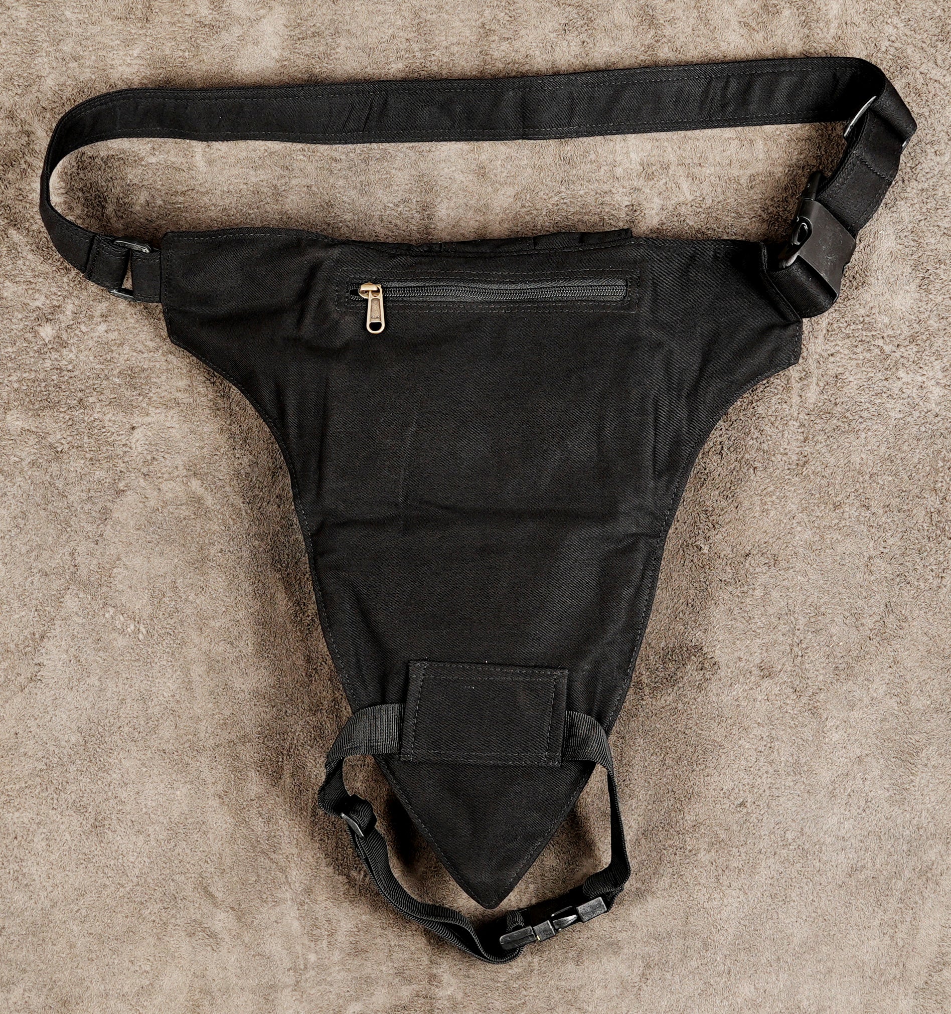 Black canvas holster belt with large studded thigh pouch