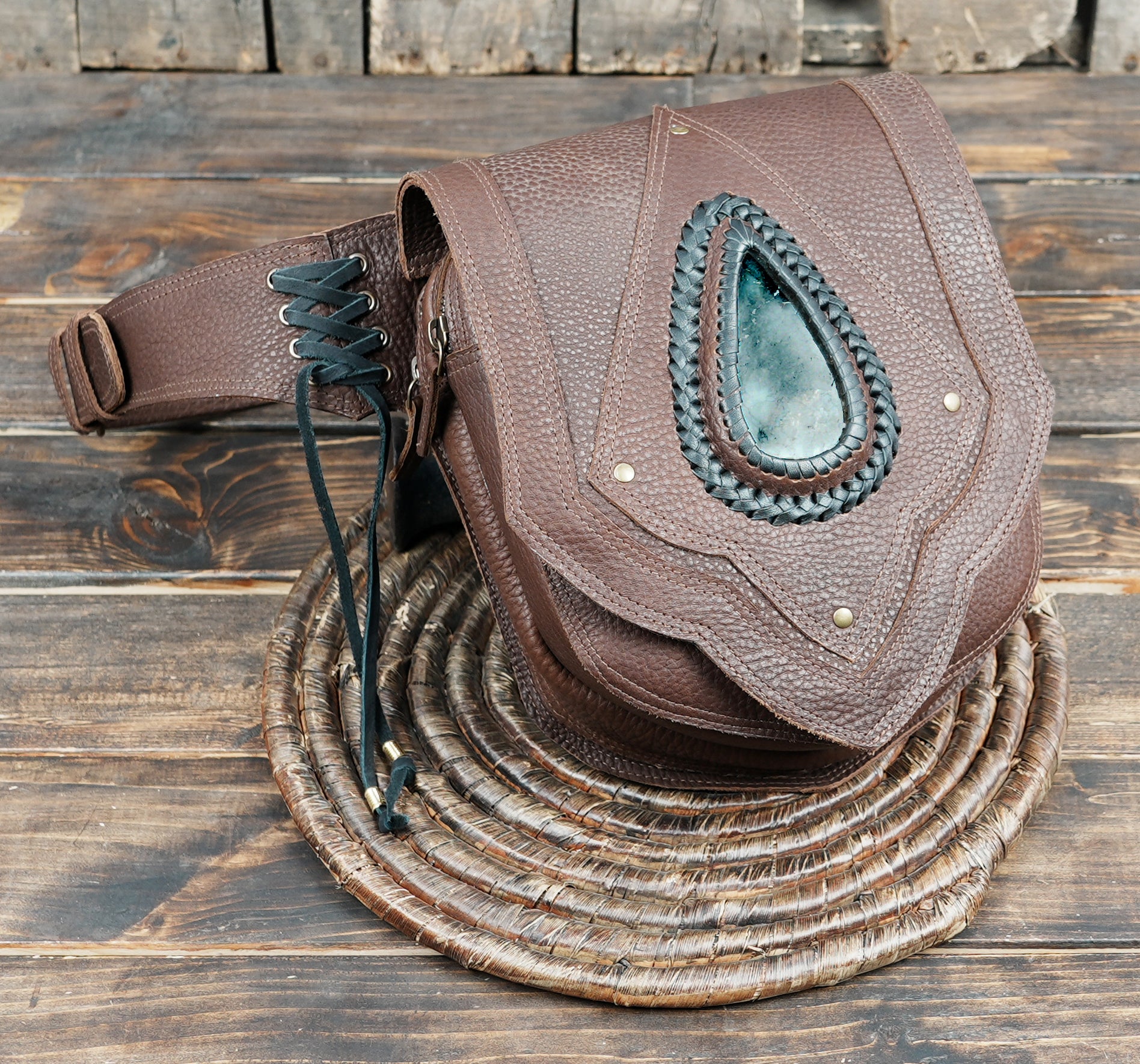 Decorative leather waist bag with gemstone centerpiece