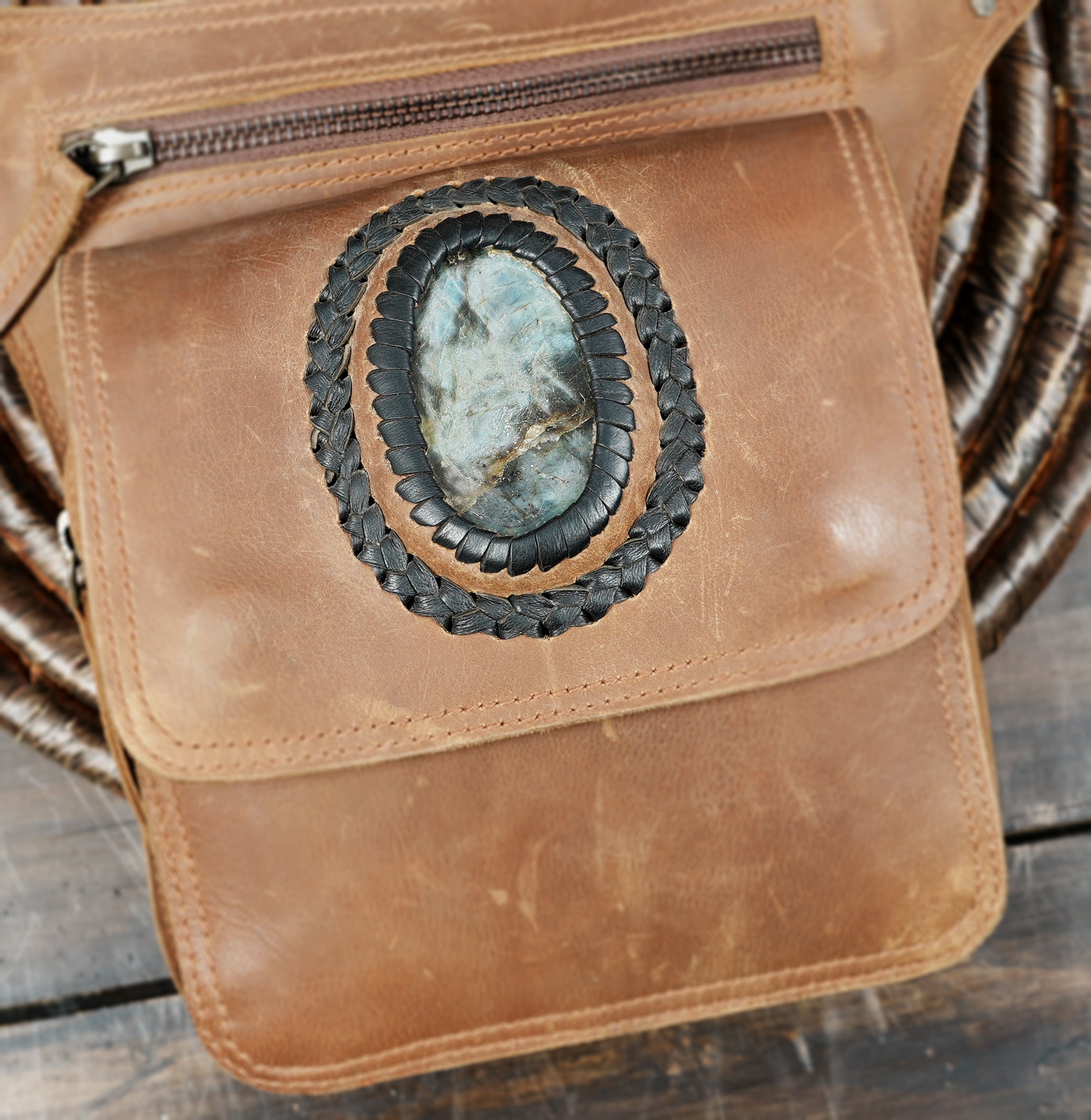 Back view of brown leather belt bag with secure zipper pocket