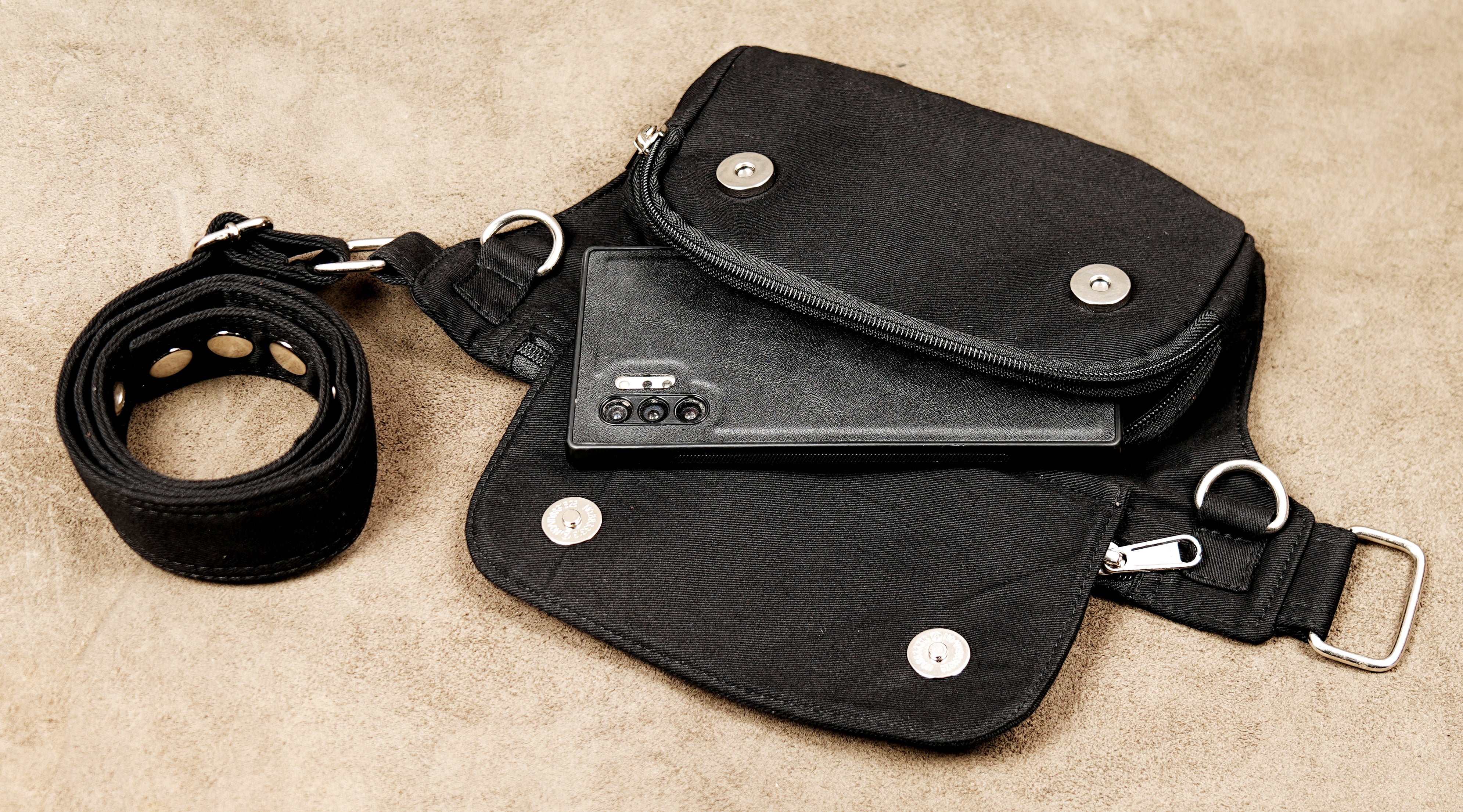 Gothic festival accessory: black canvas fanny pack with secure zipper and flap pockets.