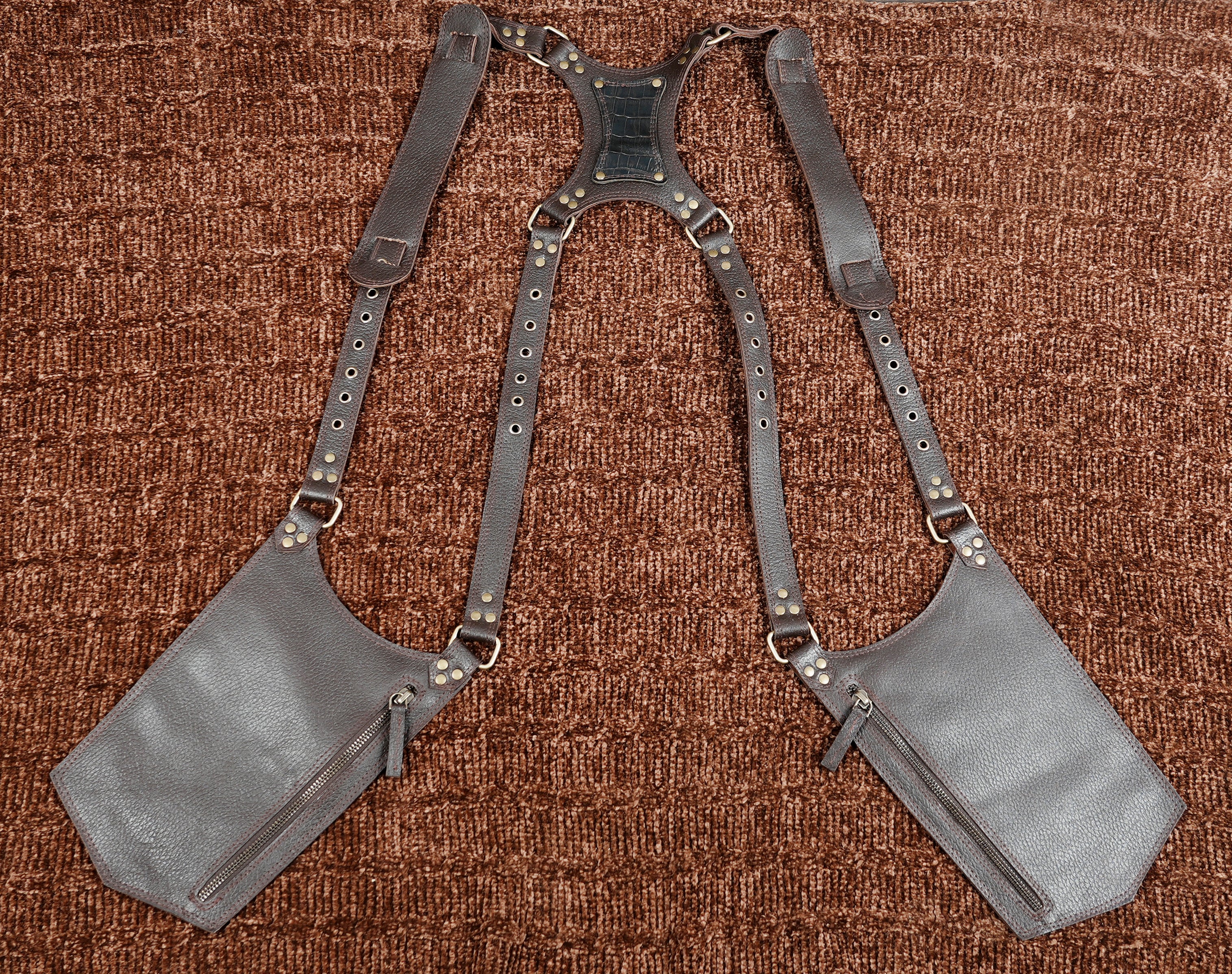 Stylish brown leather cross body holster with utility pockets