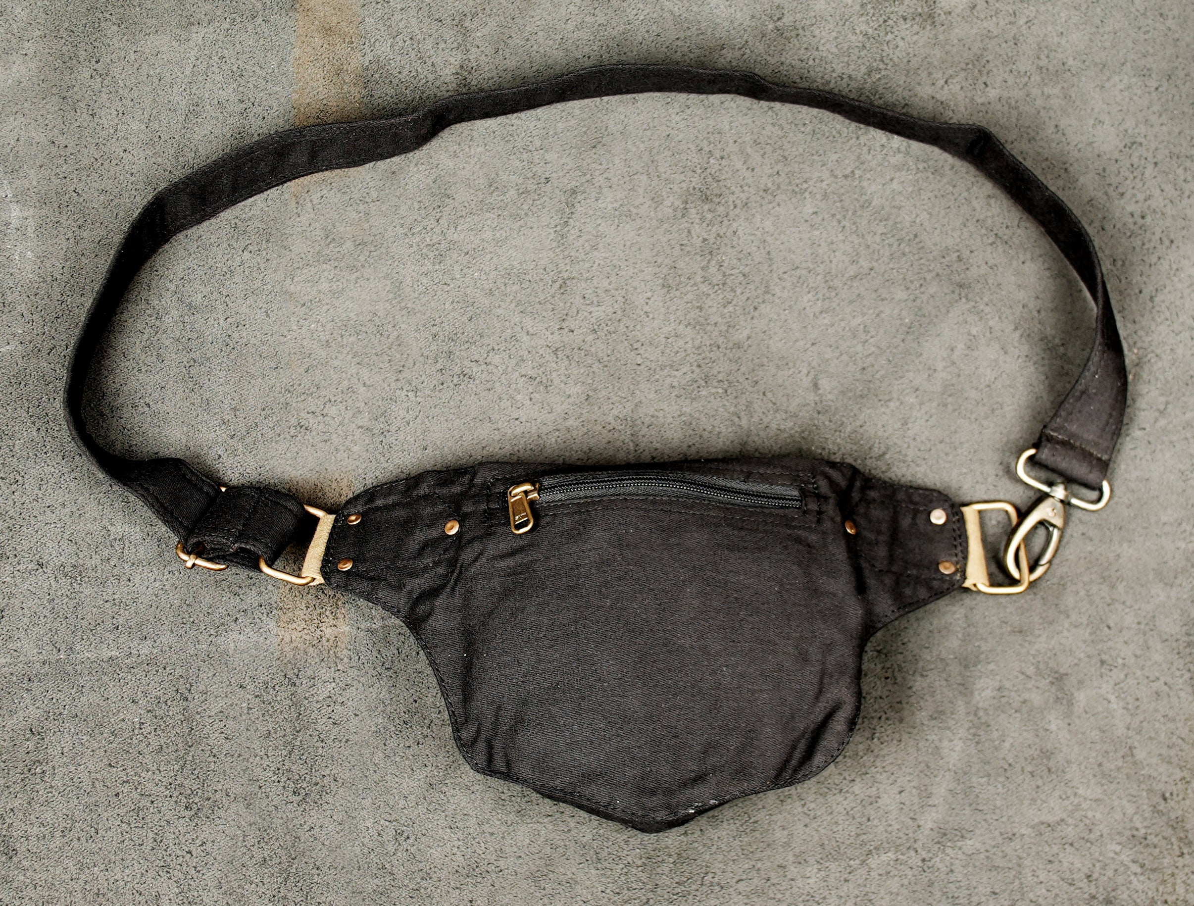 Perfect for day trips, this black cotton waist bag is lightweight and adjustable for comfort.