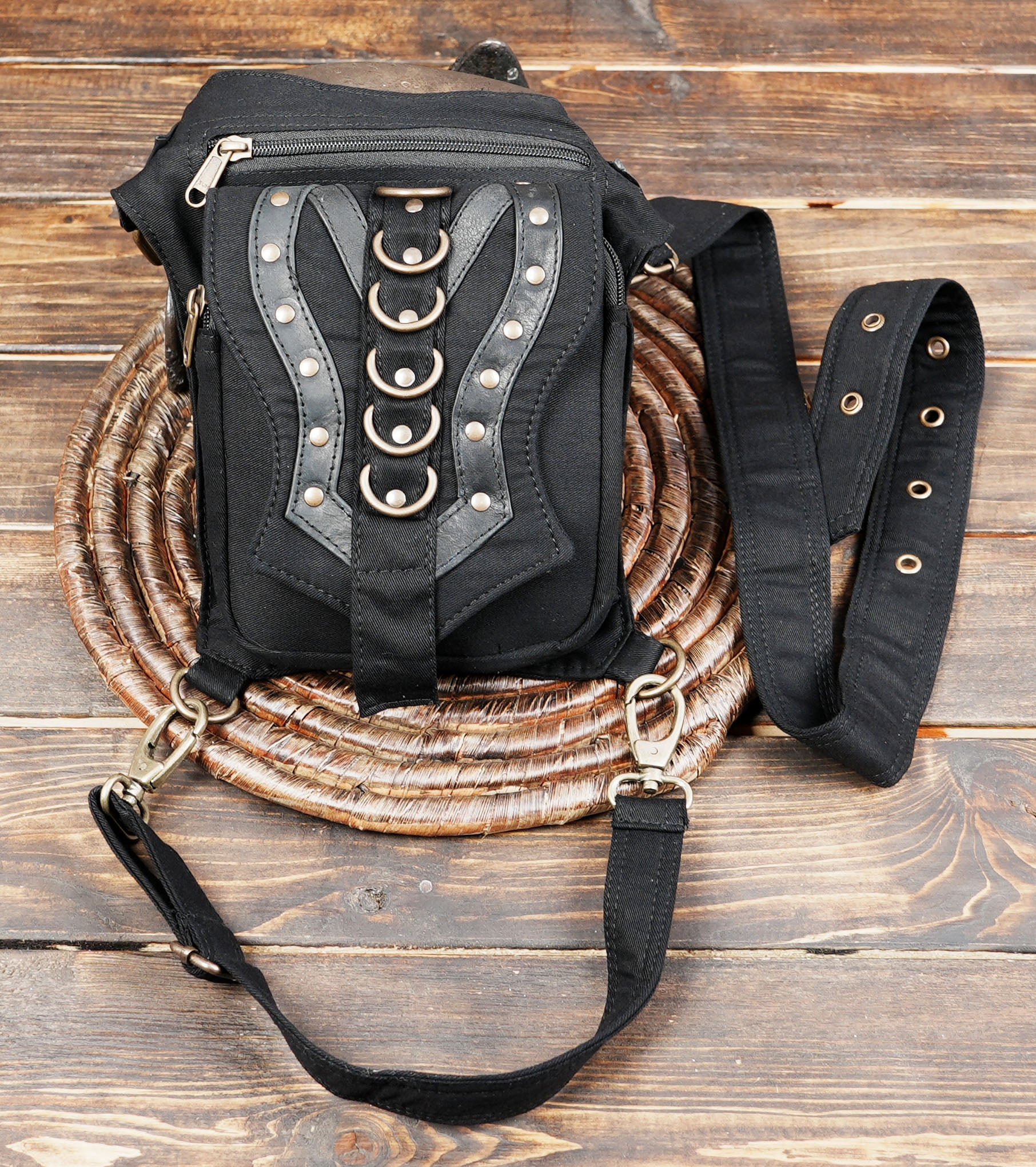 Hands-free festival utility hip pouch with adjustable waist and leg strap buckles.