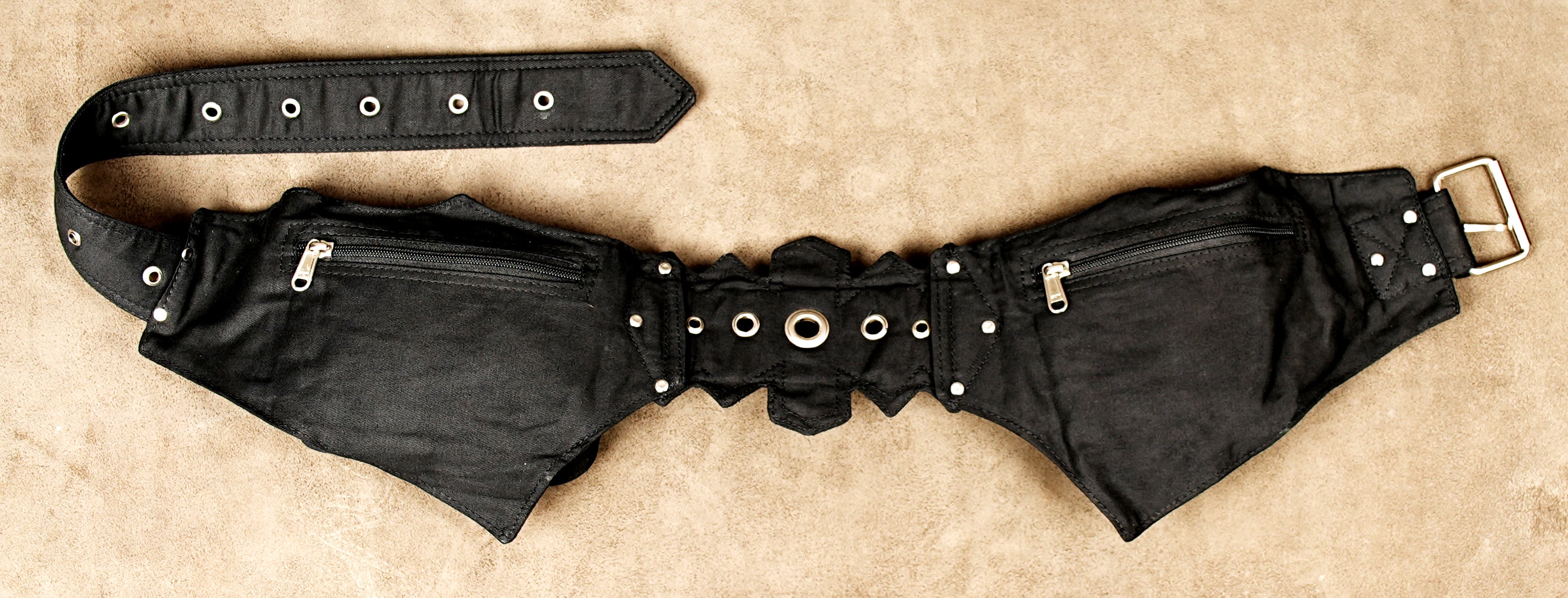 Bike messenger style utility belt with multiple pouches and adjustable strap.