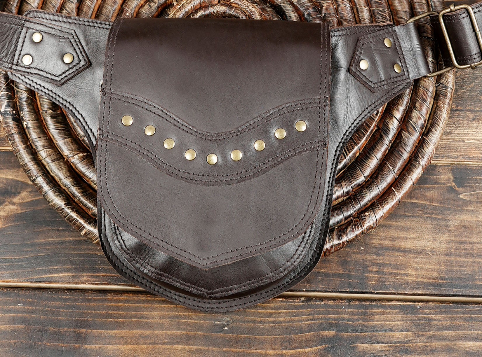 Unisex leather waist pouch with decorative stitching and studs