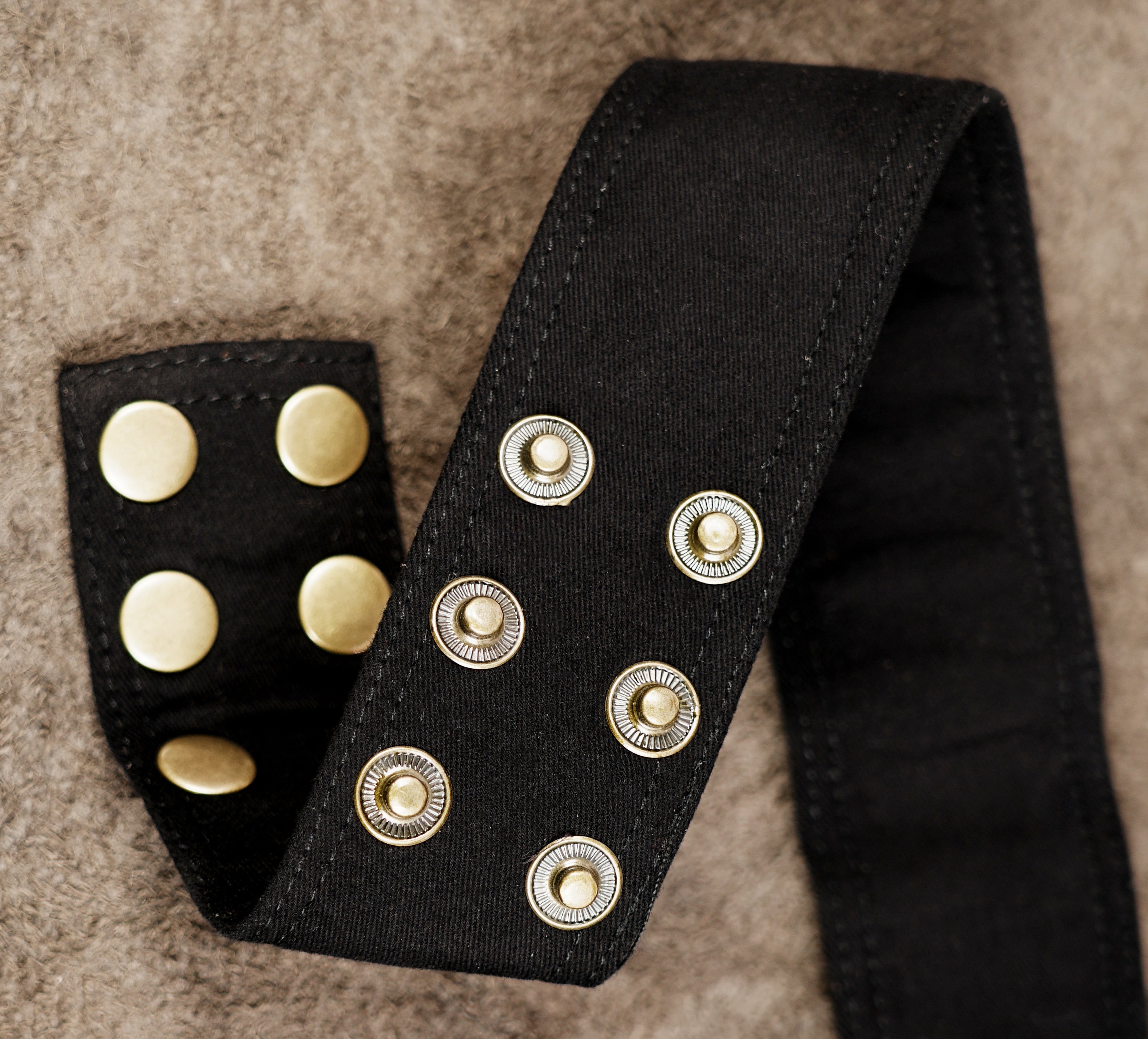 Black multi-pocket waist belt with adjustable buckle strap