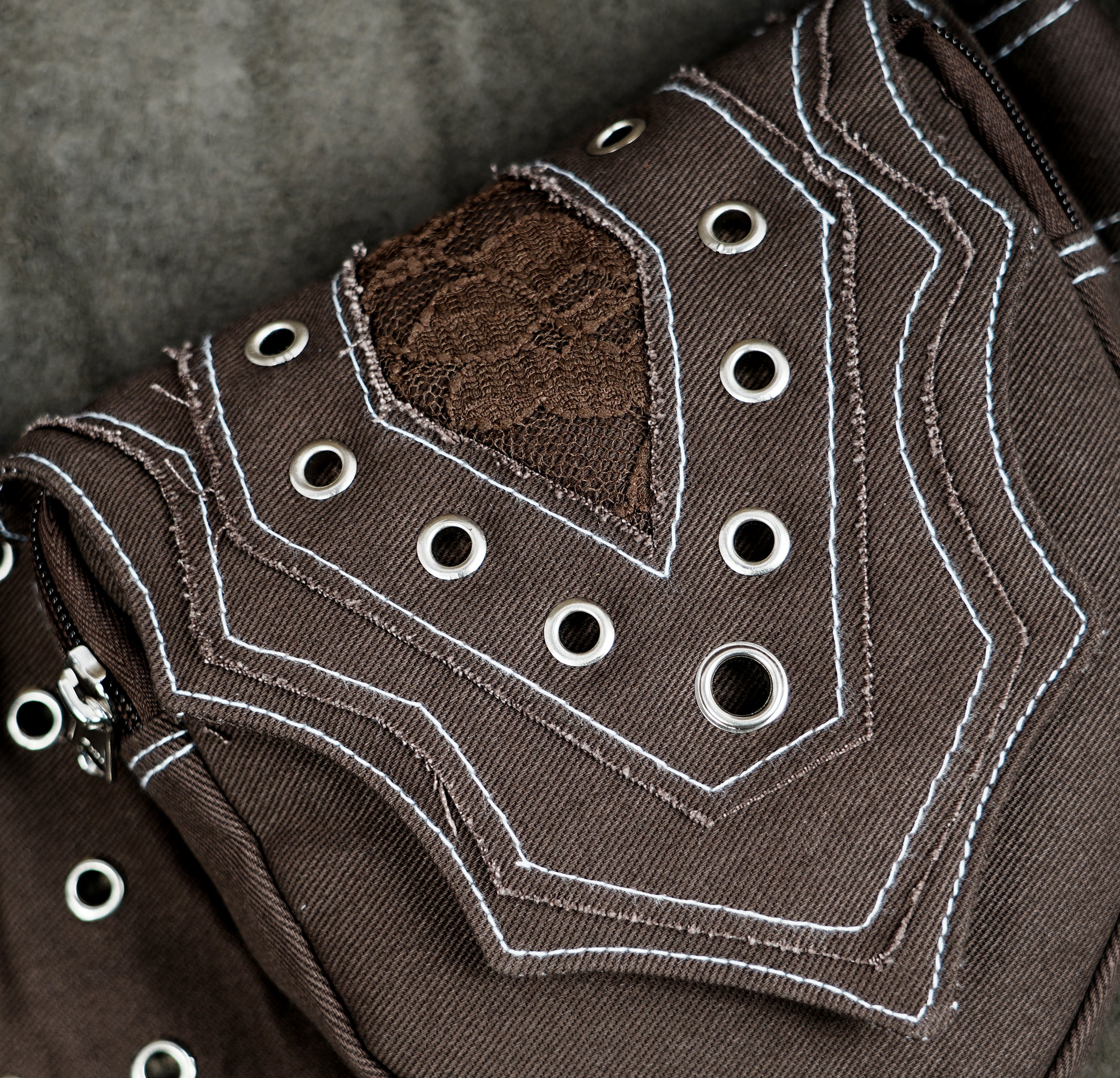 Handmade brown cotton hip pack with silver eyelets and rings