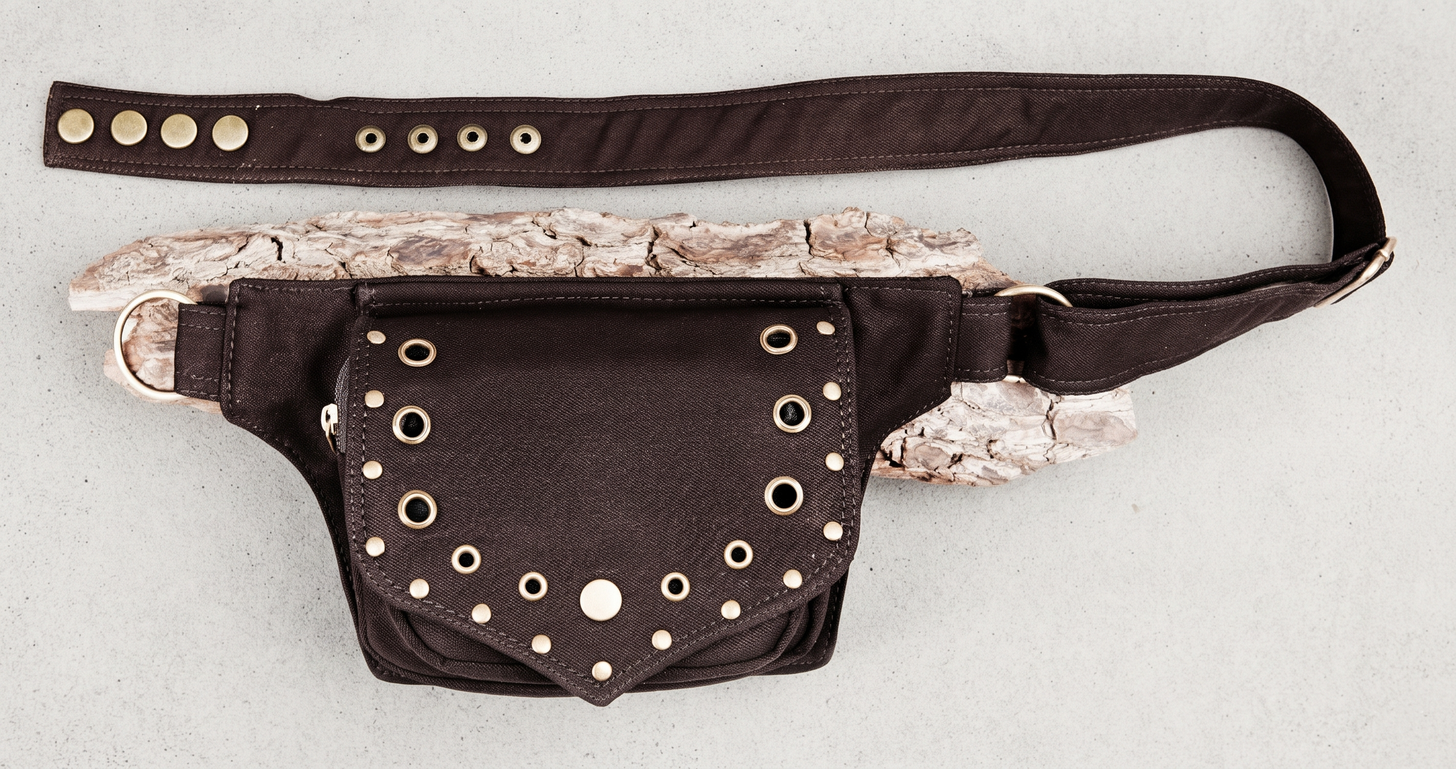 Handmade black cotton hip bag with metal grommets and adjustable strap