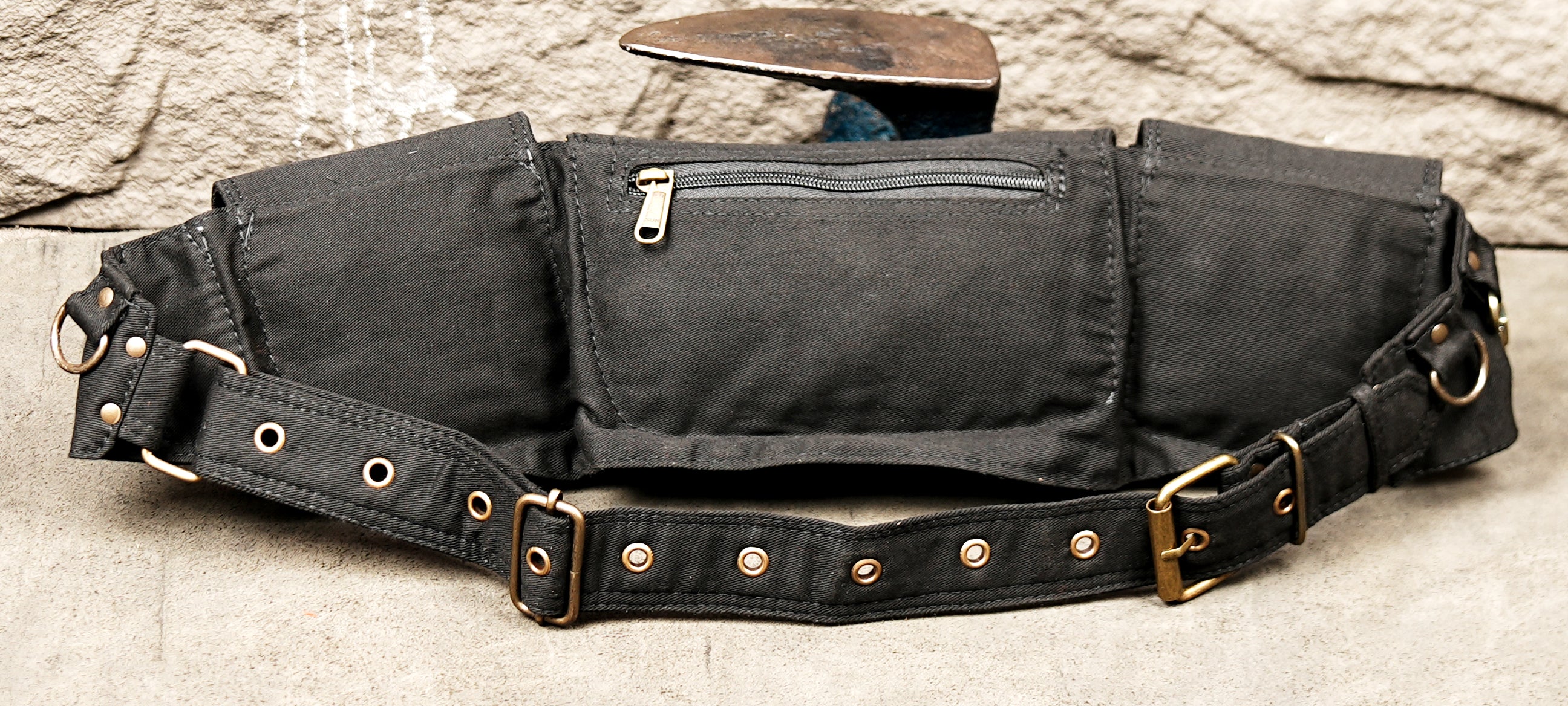 Black cotton hip pouch belt with an adjustable brass buckle