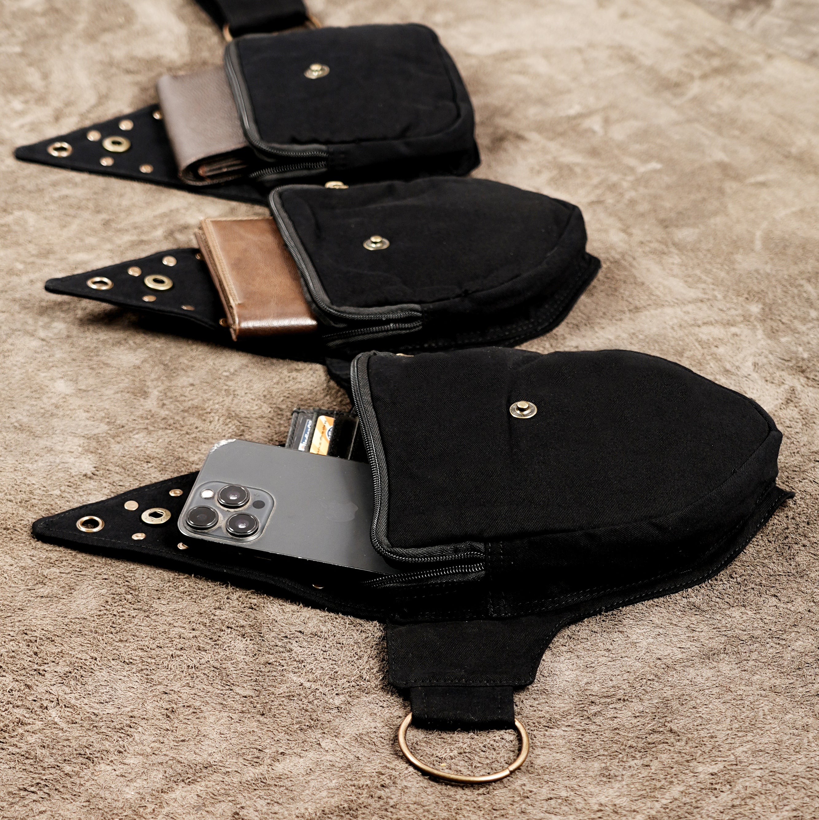 Black waist pack belt with metal studs for hiking and travel