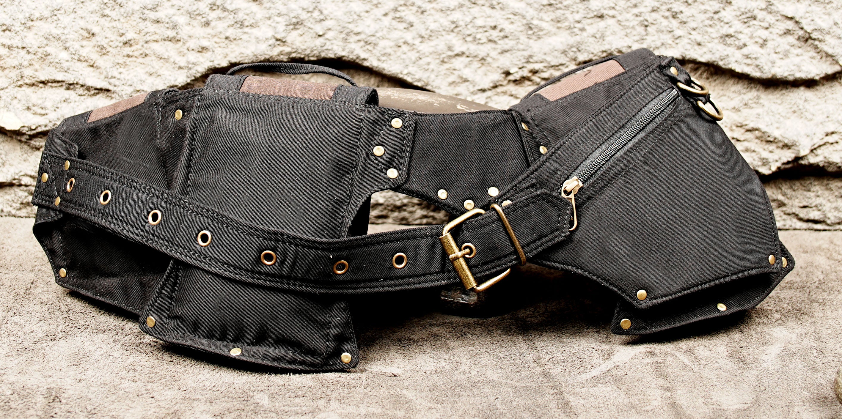 Black canvas festival waist pack with zipper and button pockets
