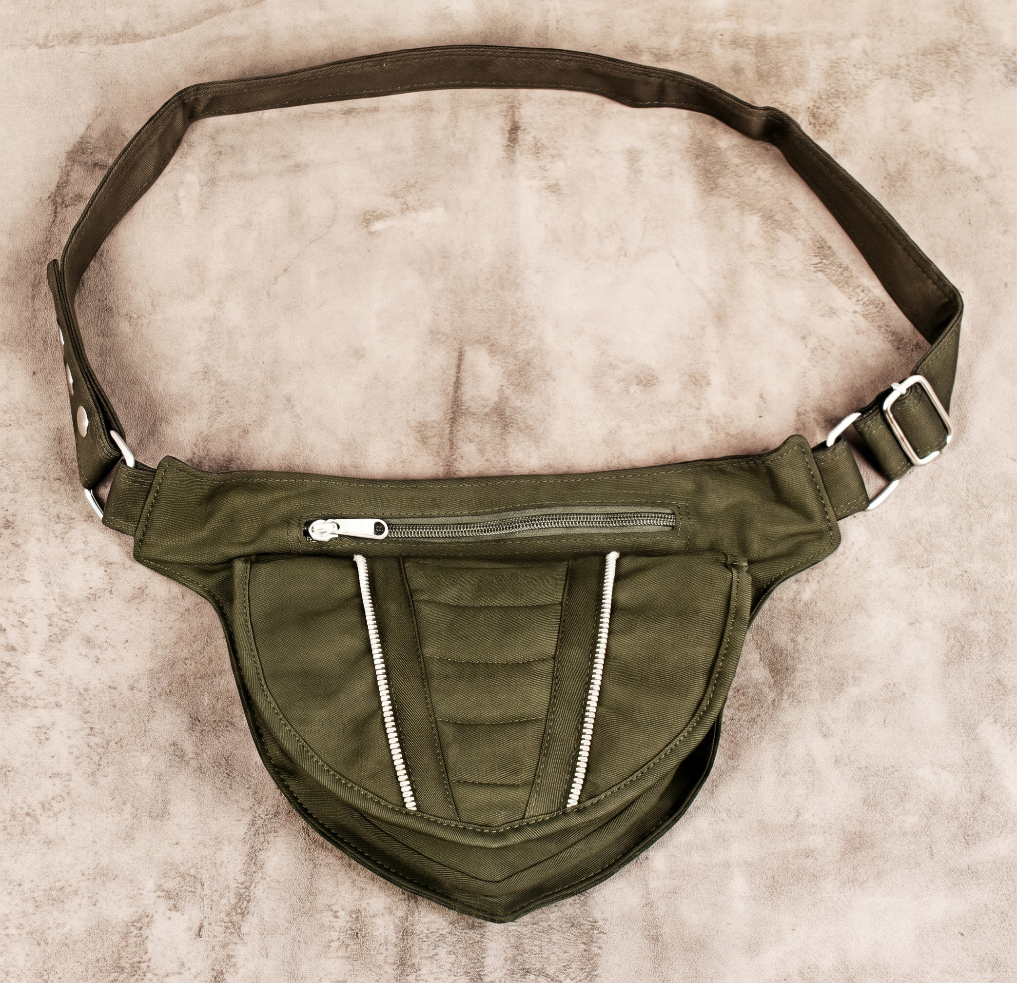 Black cotton thigh strap belt bag laid flat showing full strap and pouch