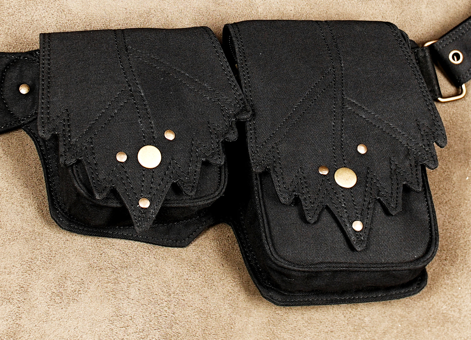 Black cotton hip belt bag with leaf design flaps and gemstone accent