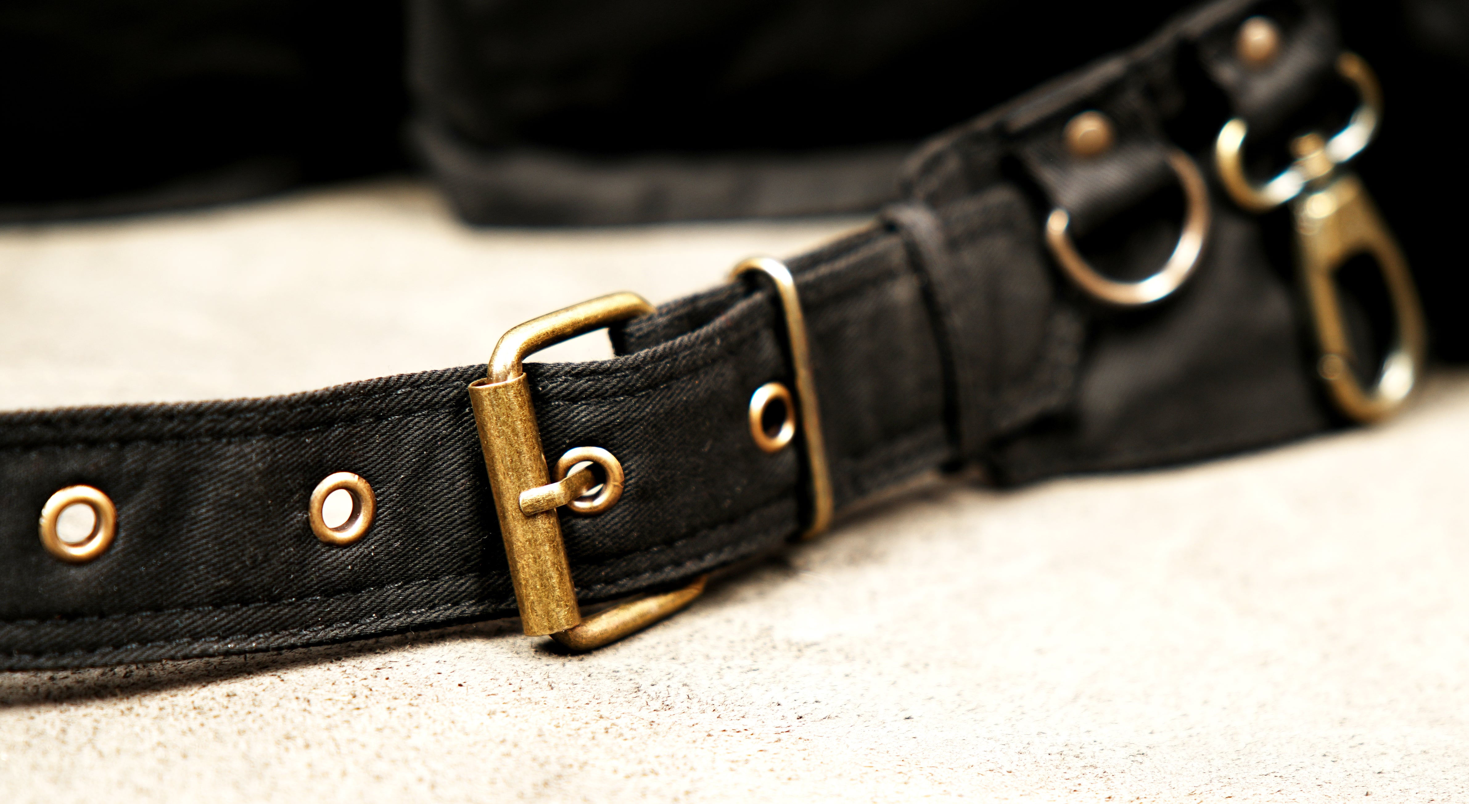 Black canvas hip belt with brass hardware for festivals