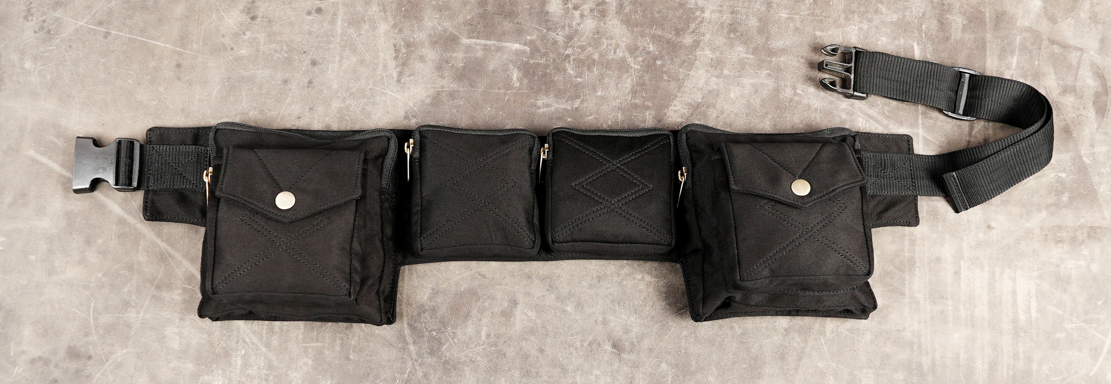 Black canvas waist belt bag with four zipper pockets