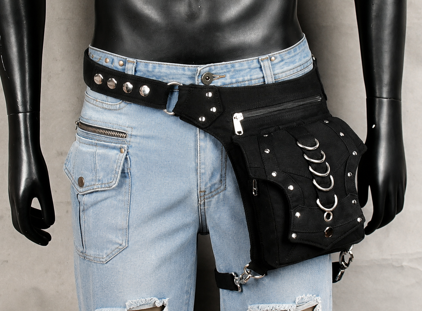 Fashion waist bag with adjustable strap and studs.