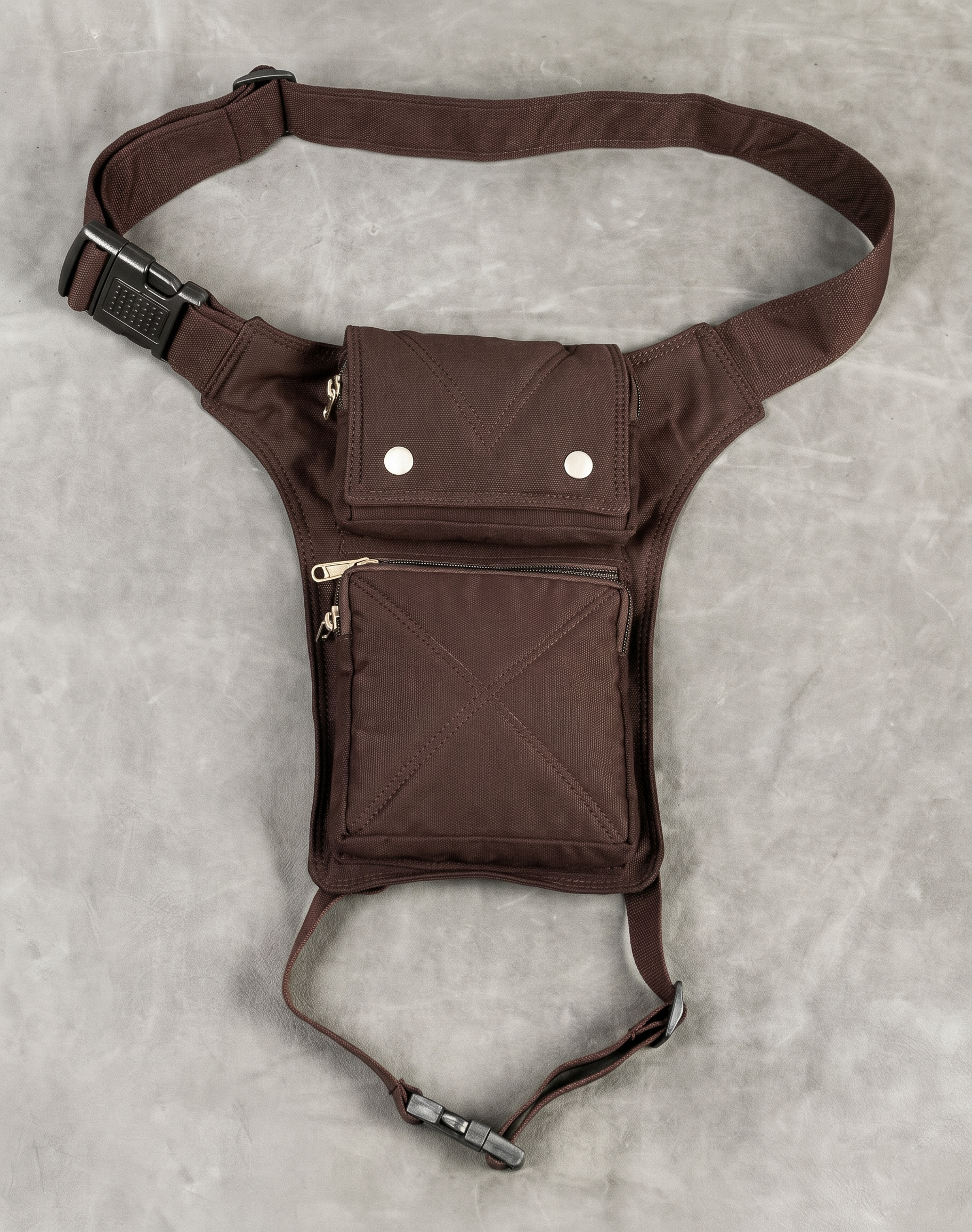 Black canvas thigh holster bag with two snap buttons and zip pocket