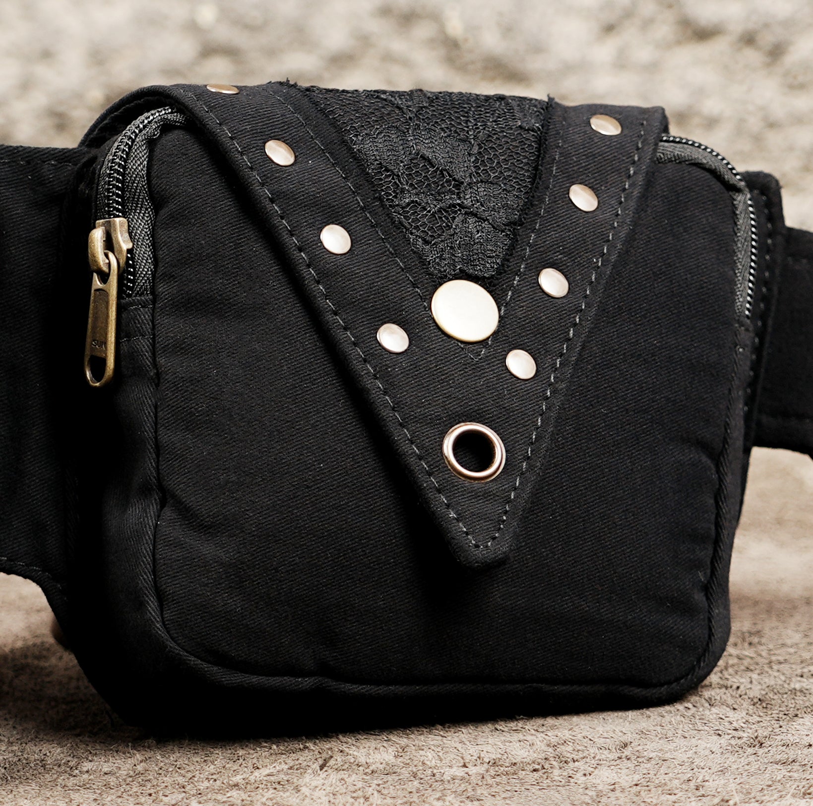 Black pocket belt with brass snap buttons and O-ring hardware