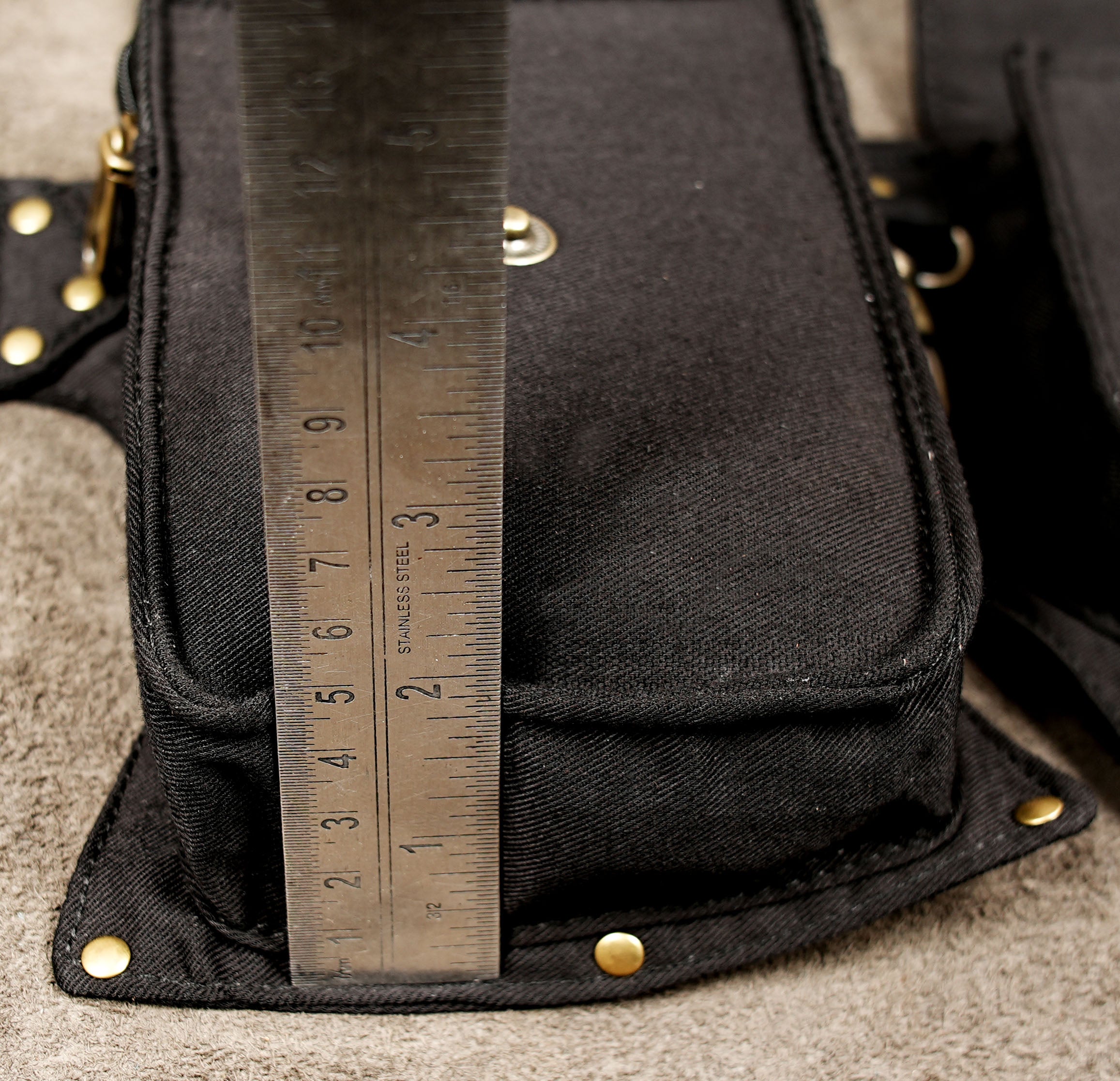 Burning Man utility belt bag made from black cotton fabric with multiple storage pouches