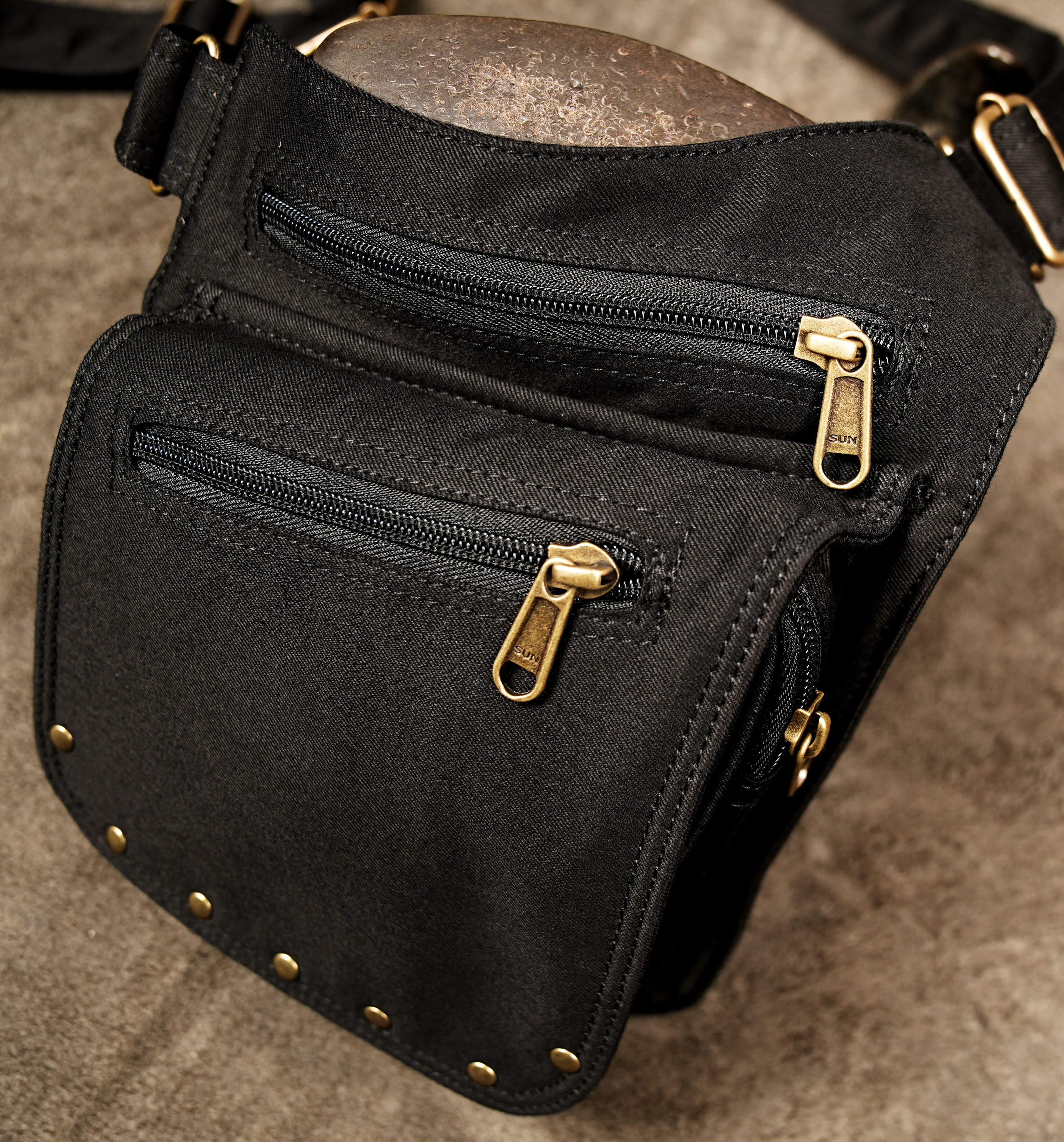 Hands-free black cotton holster bag with studded flap pockets