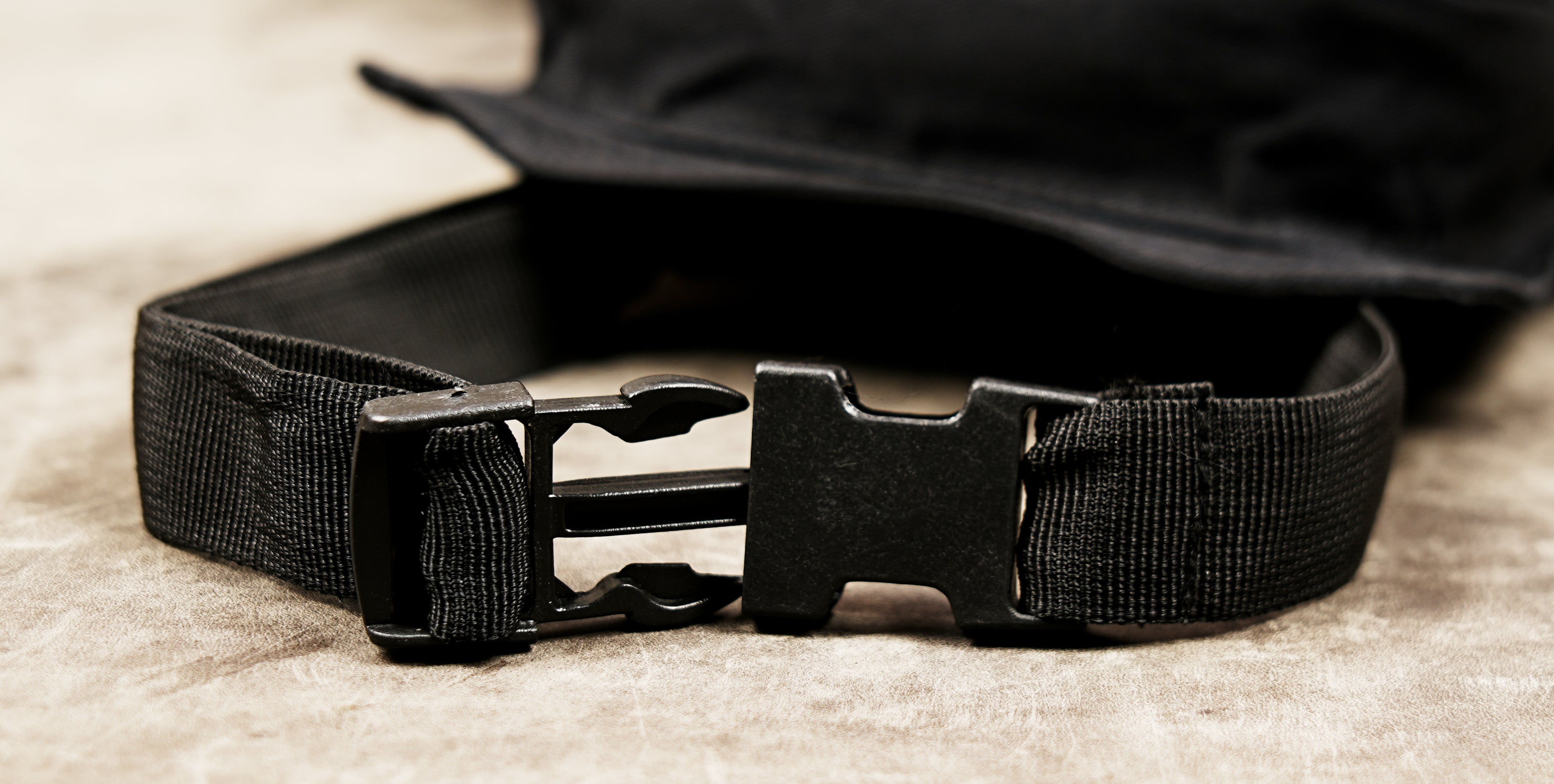 Black canvas thigh holster bag with adjustable waist and leg straps.