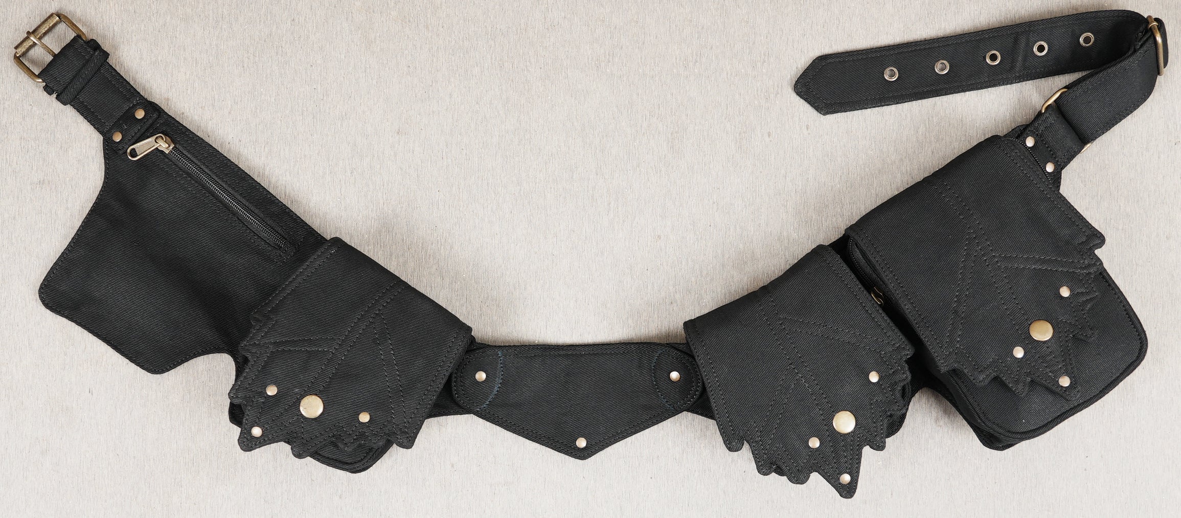 Black cotton utility belt bag with multiple detachable pouches and antique brass hardware.