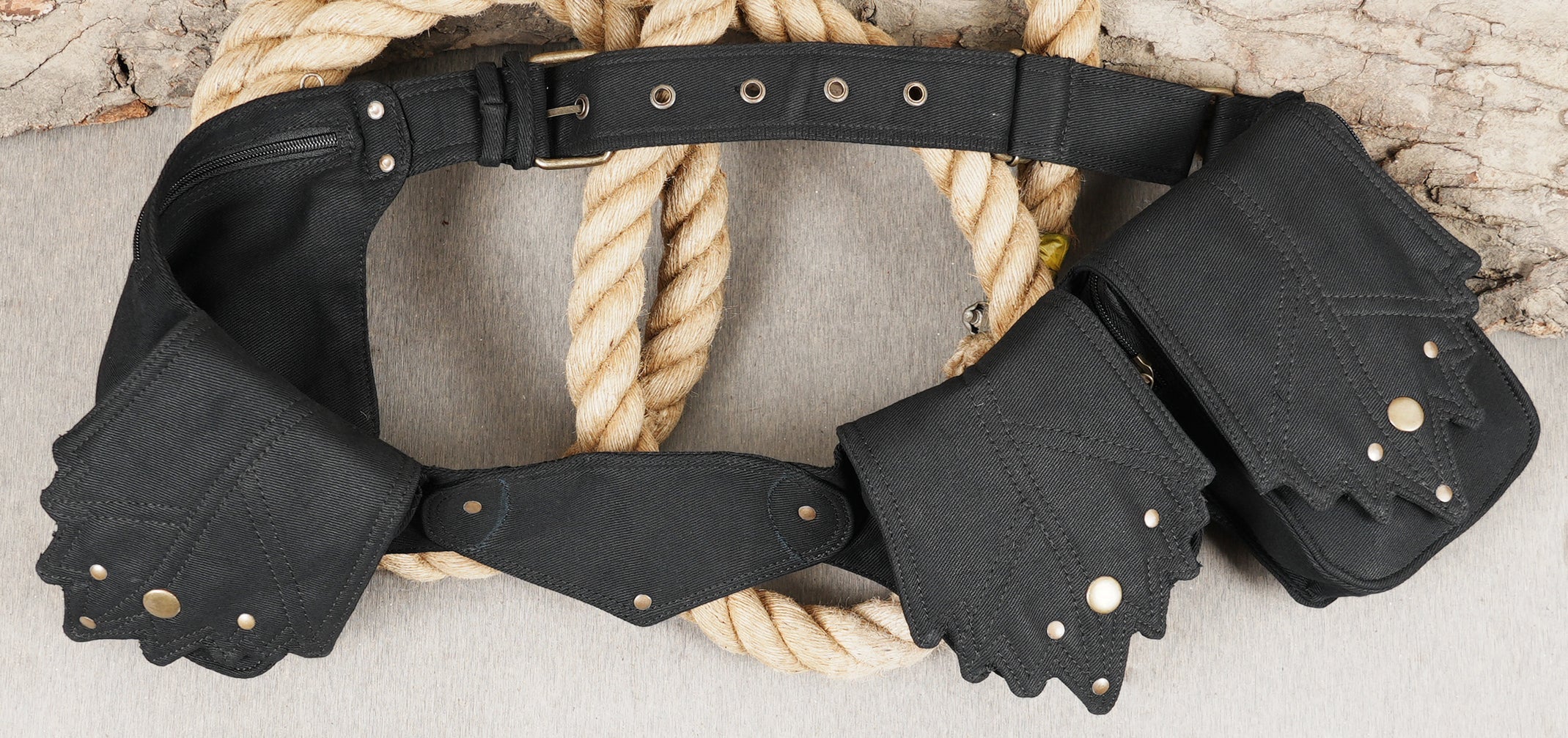 Versatile waist pack for men or women, multi-compartment utility belt with brass studs.