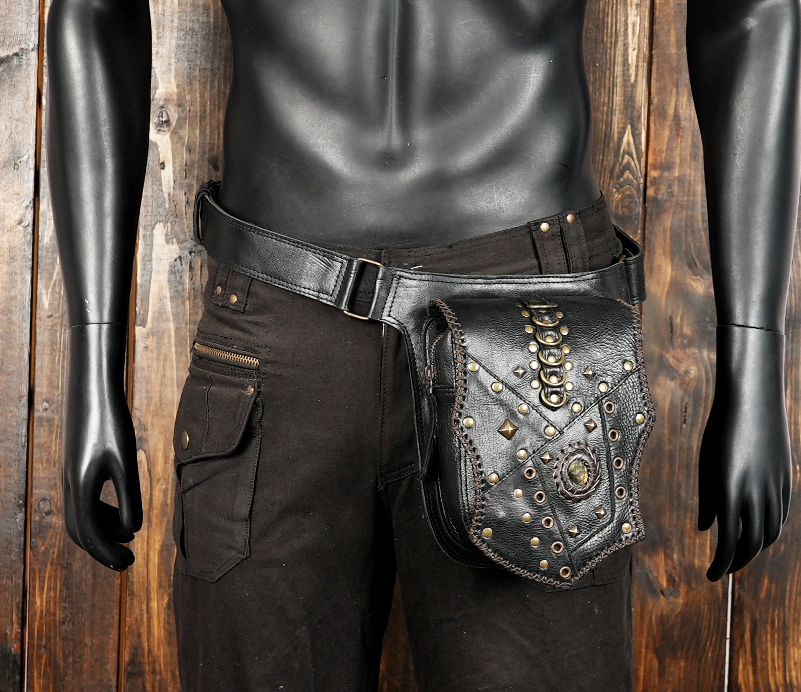 Handmade leather utility belt with studded pouch and brass rings