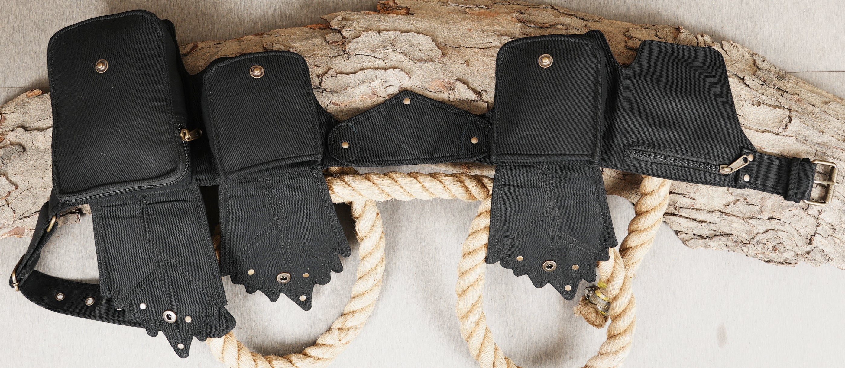 Hands-free travel waist bag with 4 varied size pouches on a secure, adjustable belt.