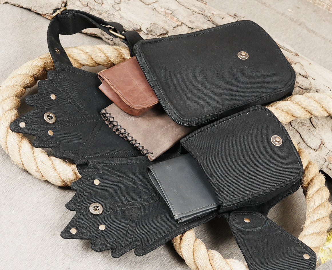 Adjustable black waist belt with 4 discrete pouches for keeping valuables safe and organized.