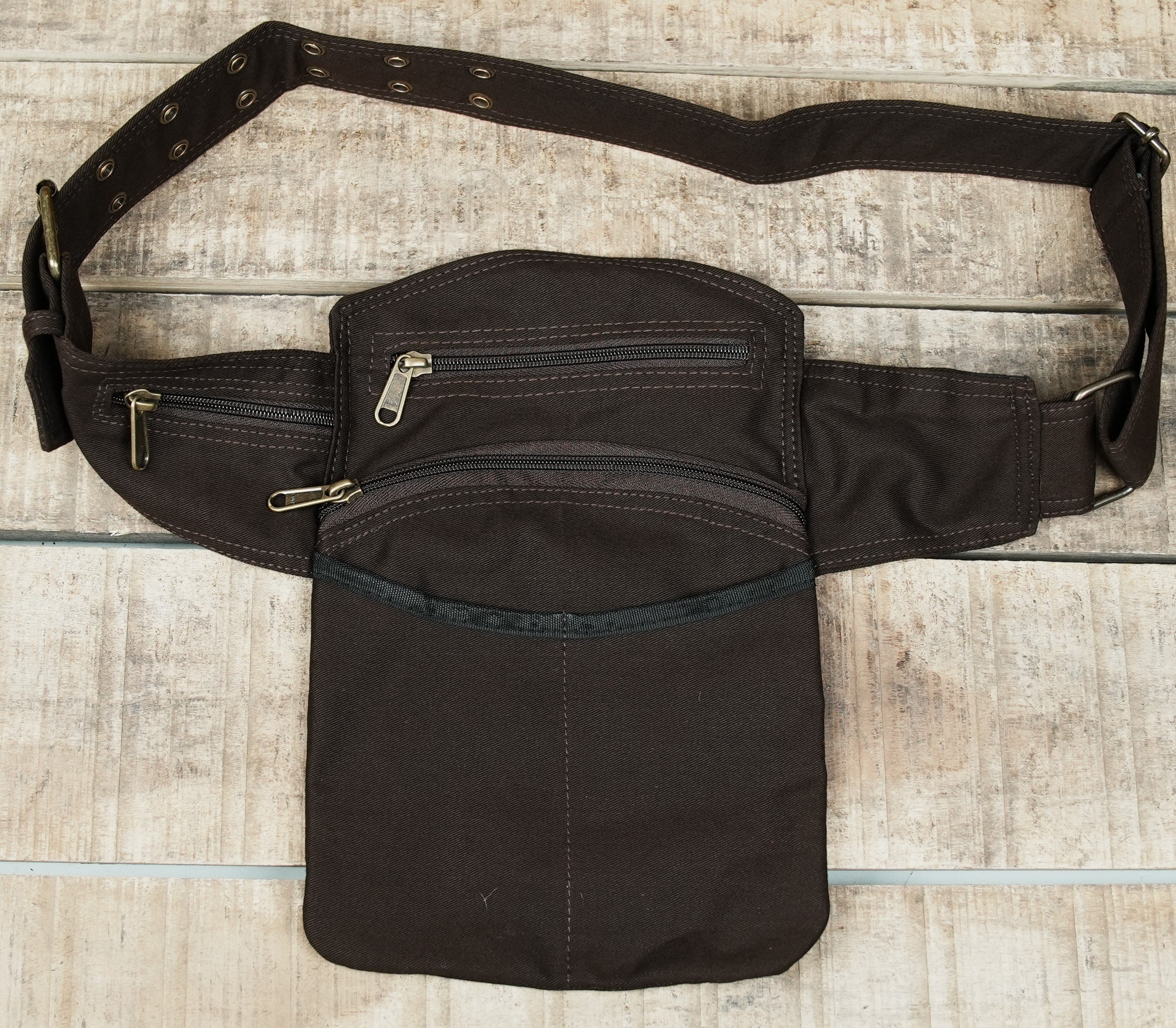 Canvas fanny pack with front pockets laid flat