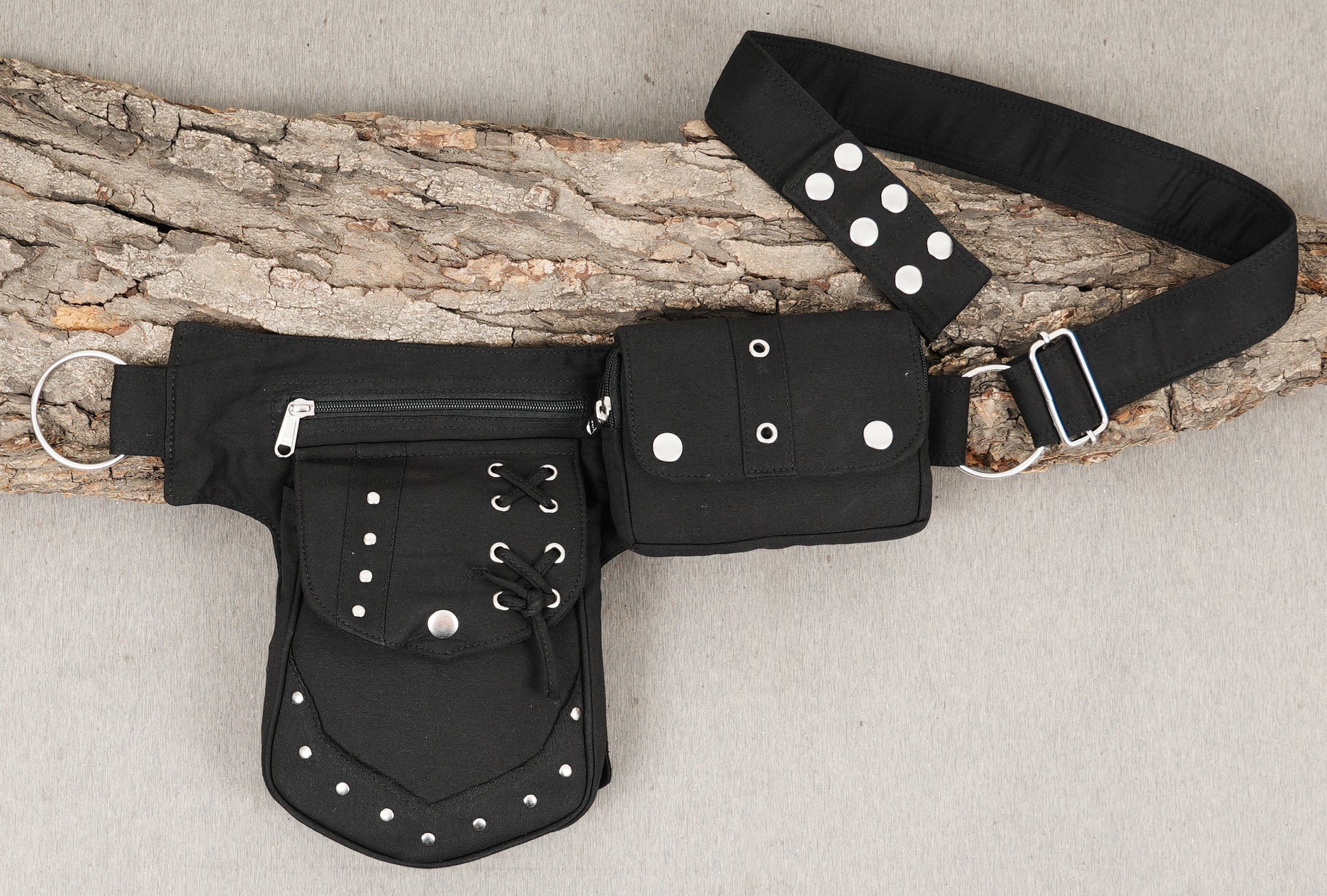 A secure, multi-pouch cotton canvas hip bag, perfect for everyday carrying or travel.