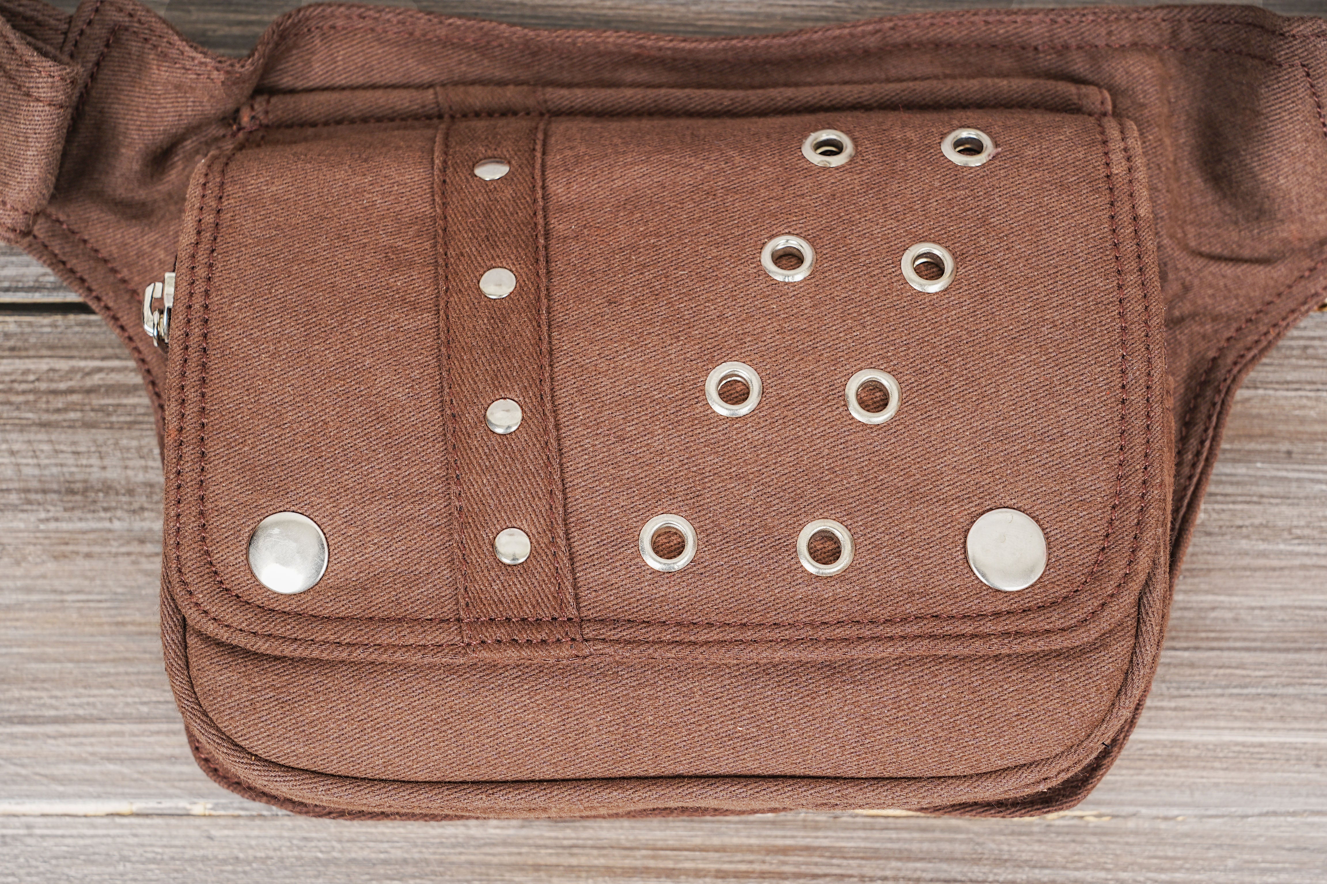 Practical brown utility belt bag with secure metal hardware.