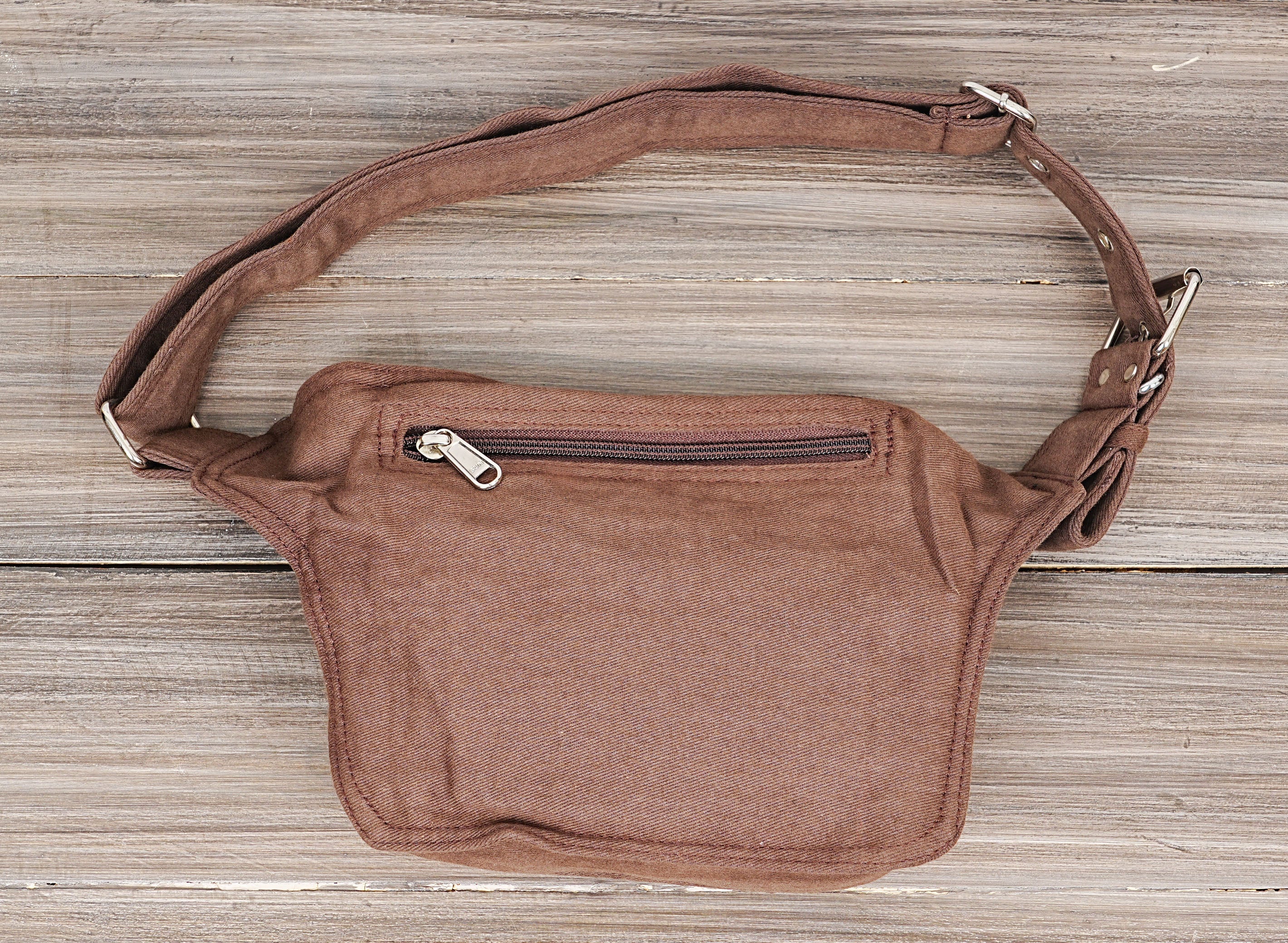 Brown cotton canvas waist bag with metal stud detailing.