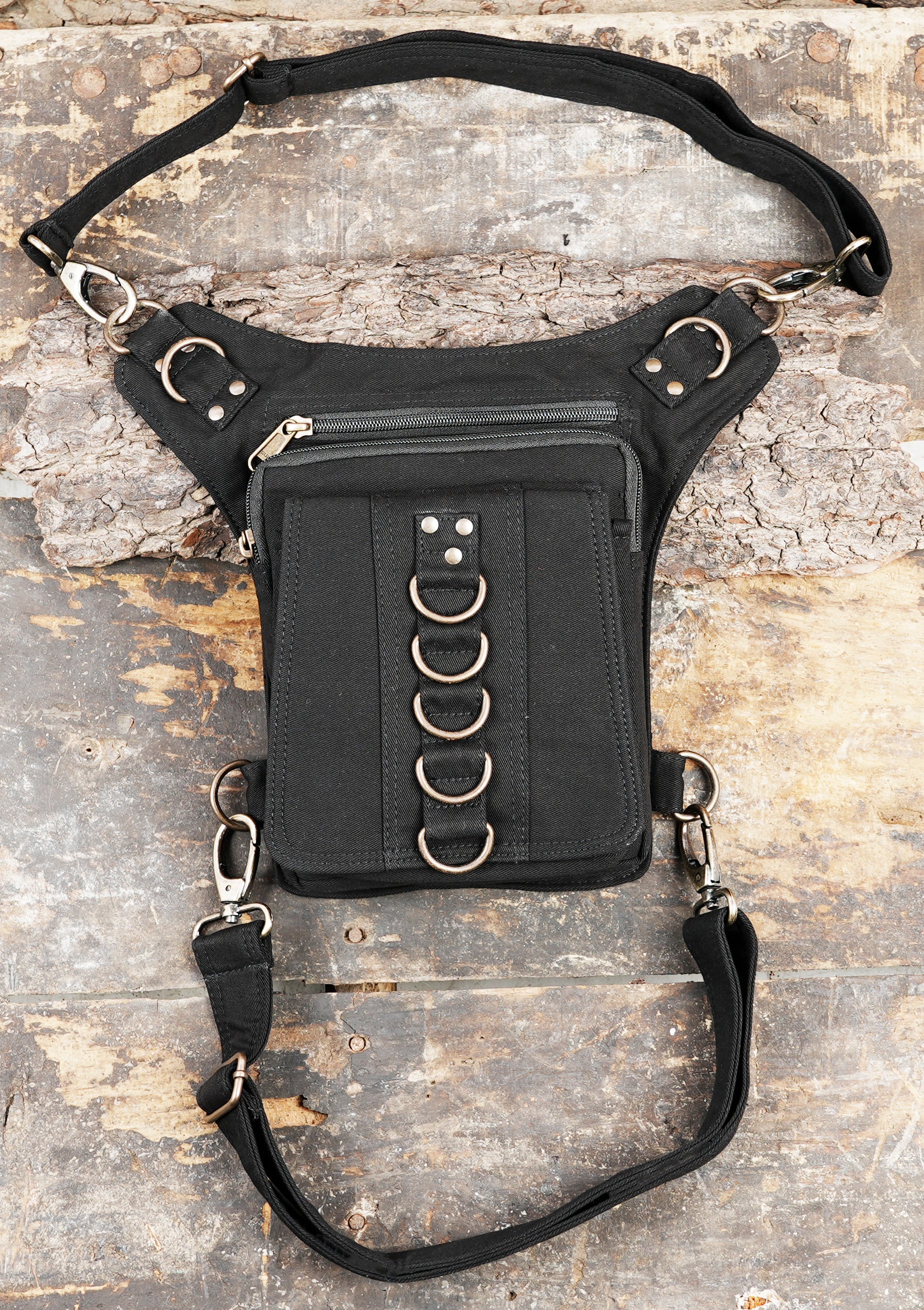 Black canvas drop leg bag with stacked D-ring hardware