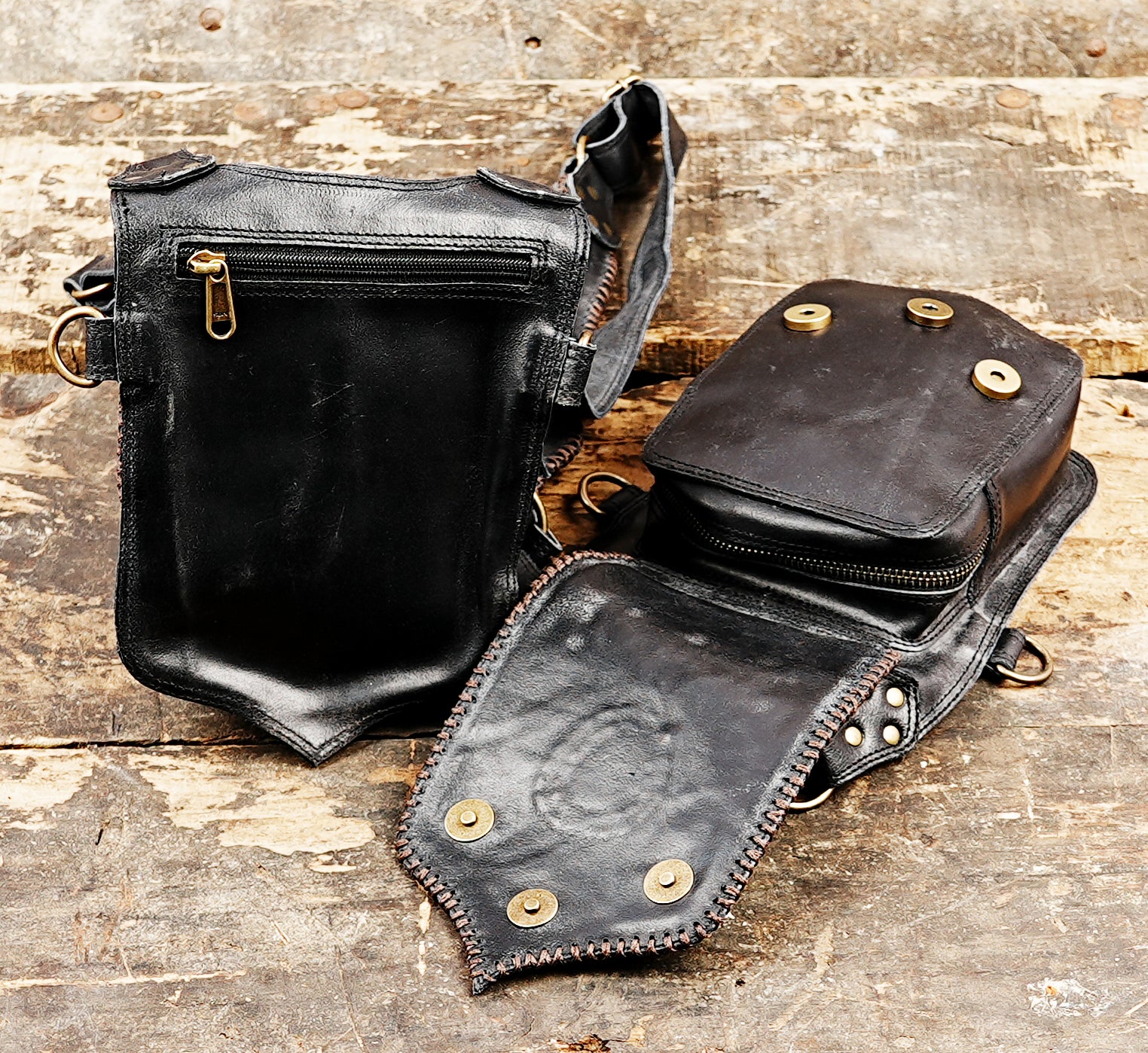 “Black leather harness holster with gemstone inlay and copper rivet accents”